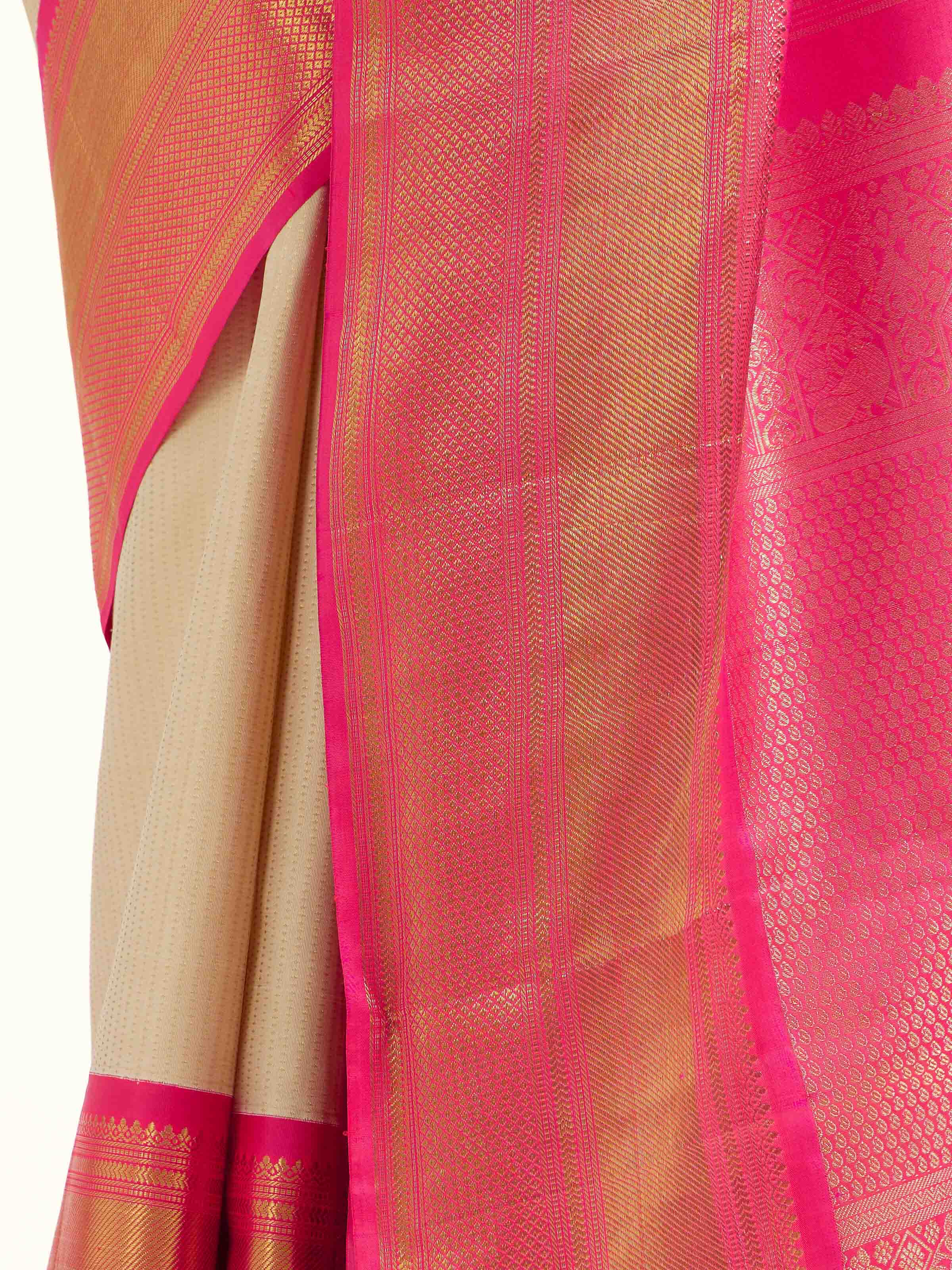 Detail view of cream silk Kancheepuram saree showing silk texture and zari craftsmanship