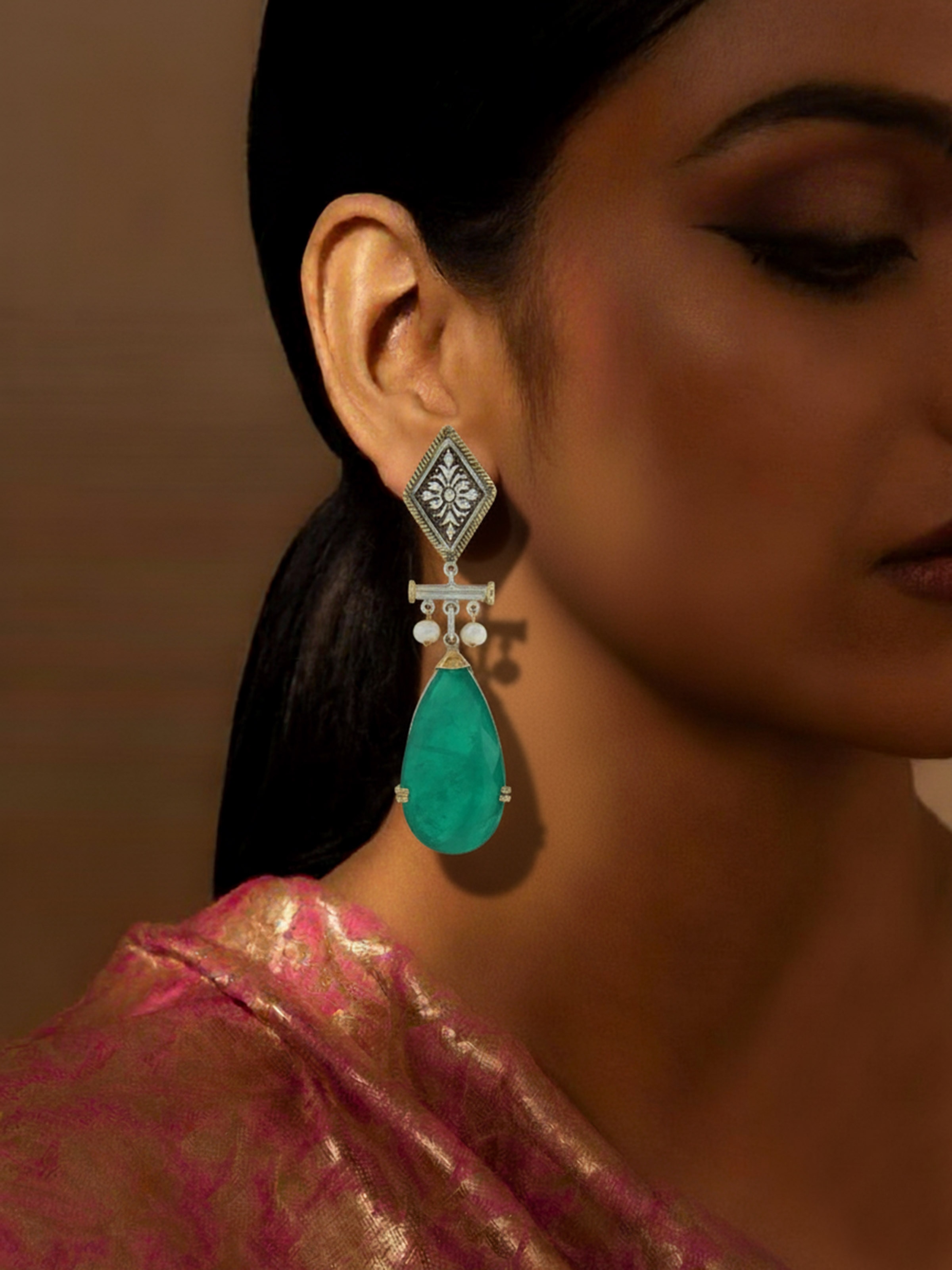 Silver smithing drop earrings worn on ears – Swadesh
