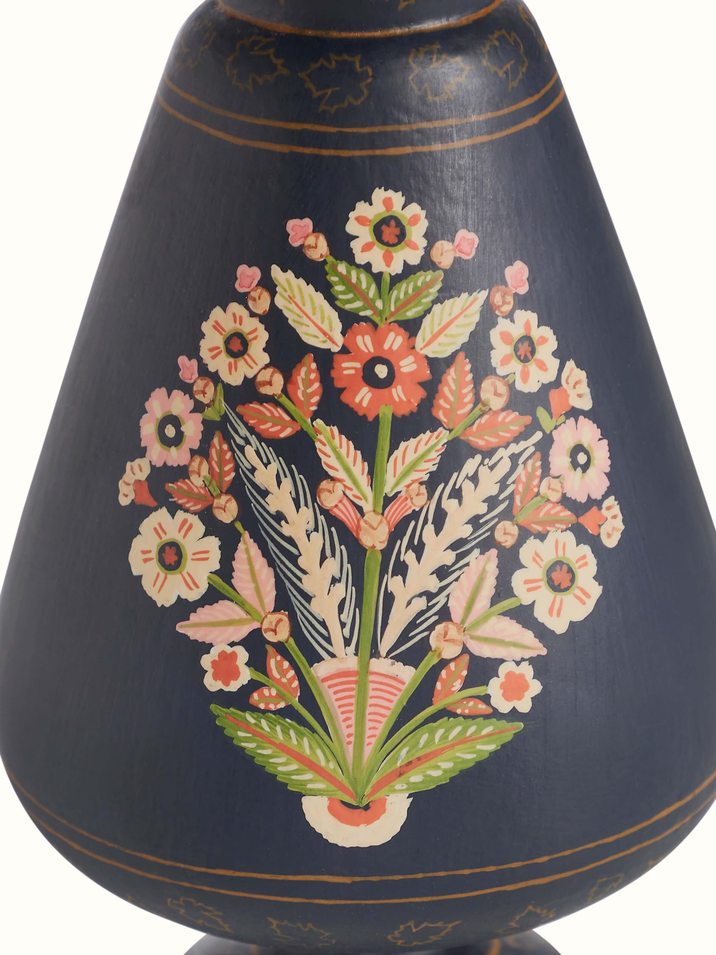 Detailed view of Papier-mache table vase in multicolor highlighting textures and patterns
