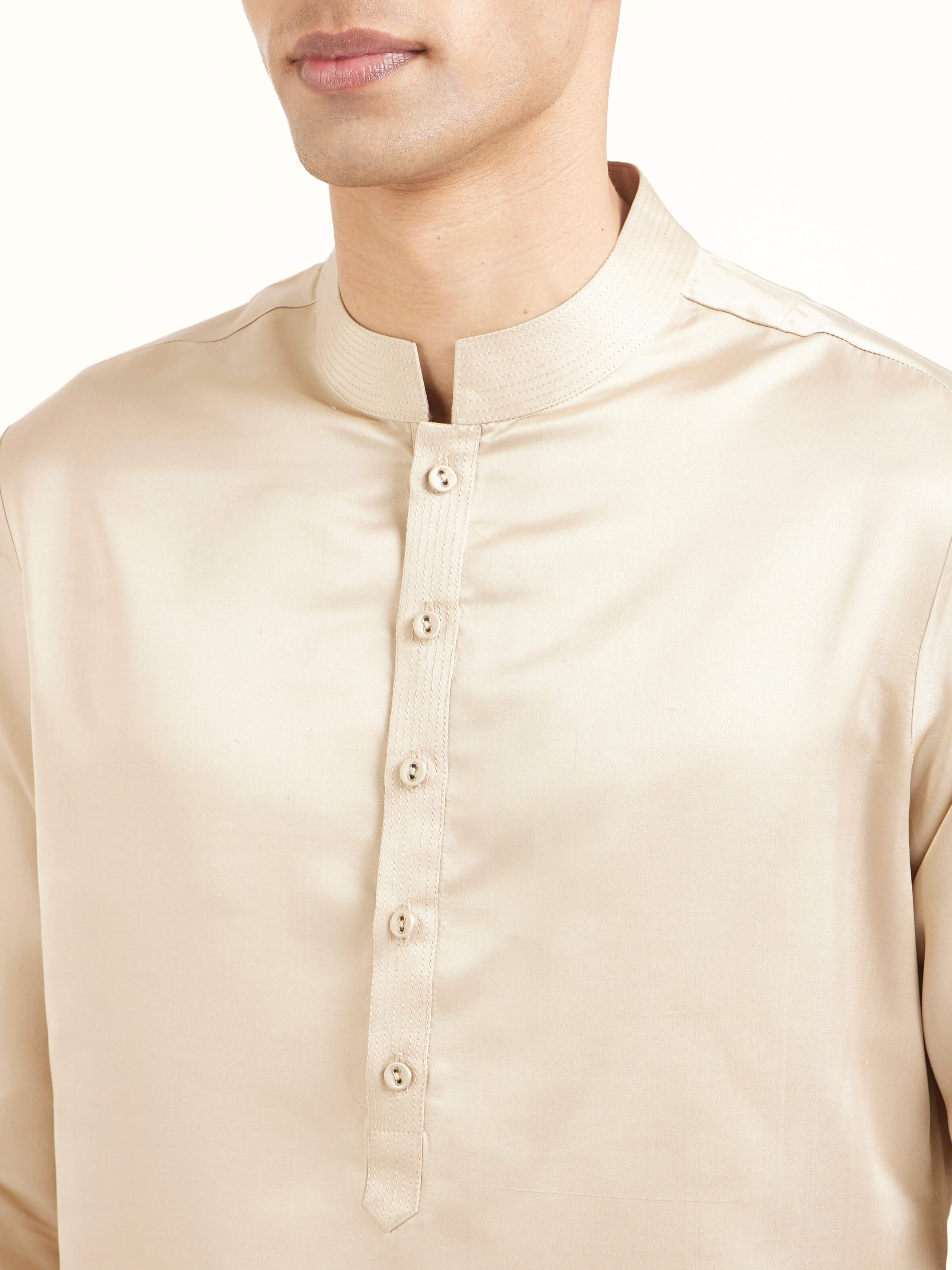 Detail view of beige katan silk Banarasi long kurta churidar set showcasing intricate fabric texture