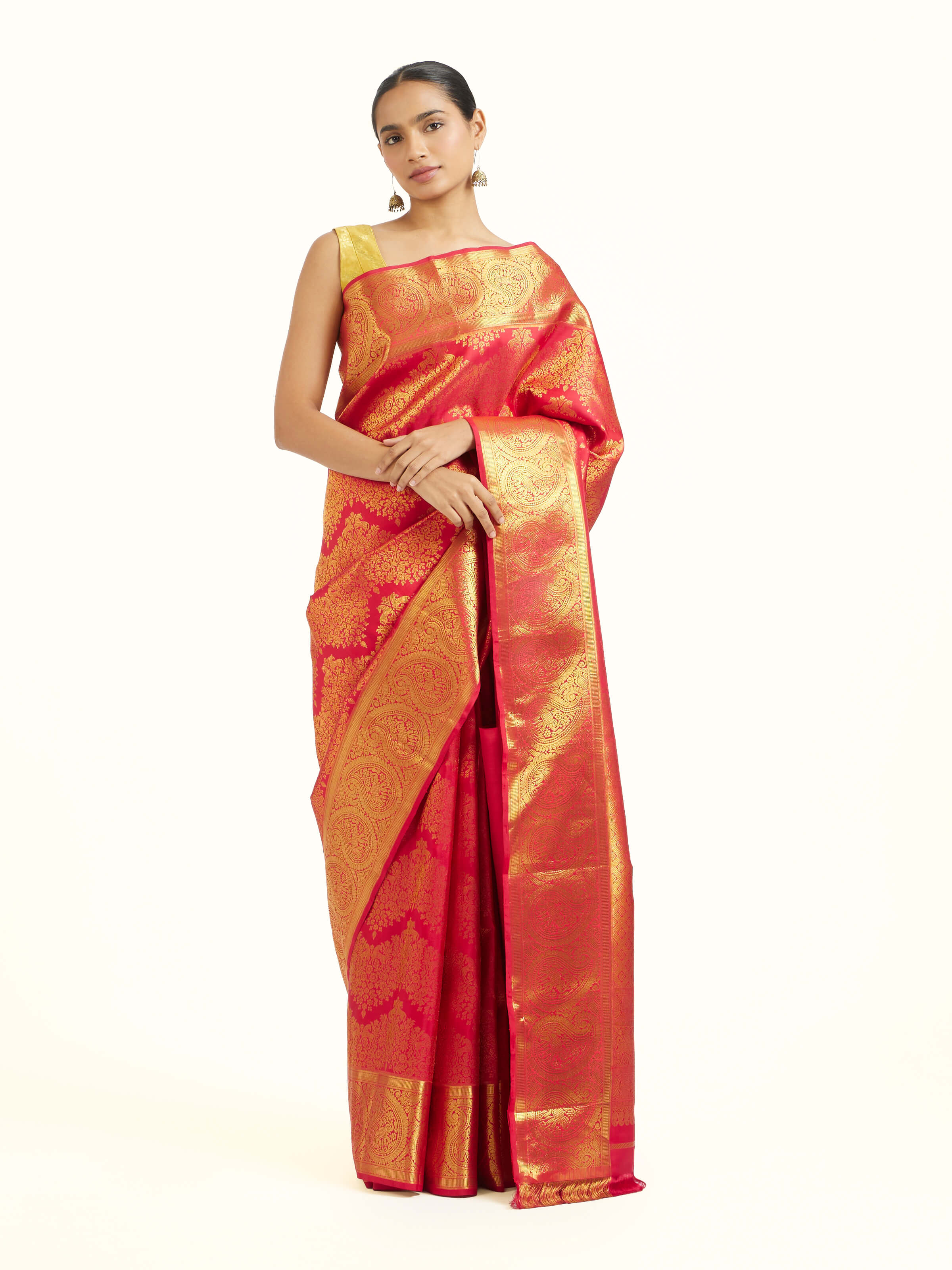 Front view of red silk Kancheepuram saree with rich zari woven motifs