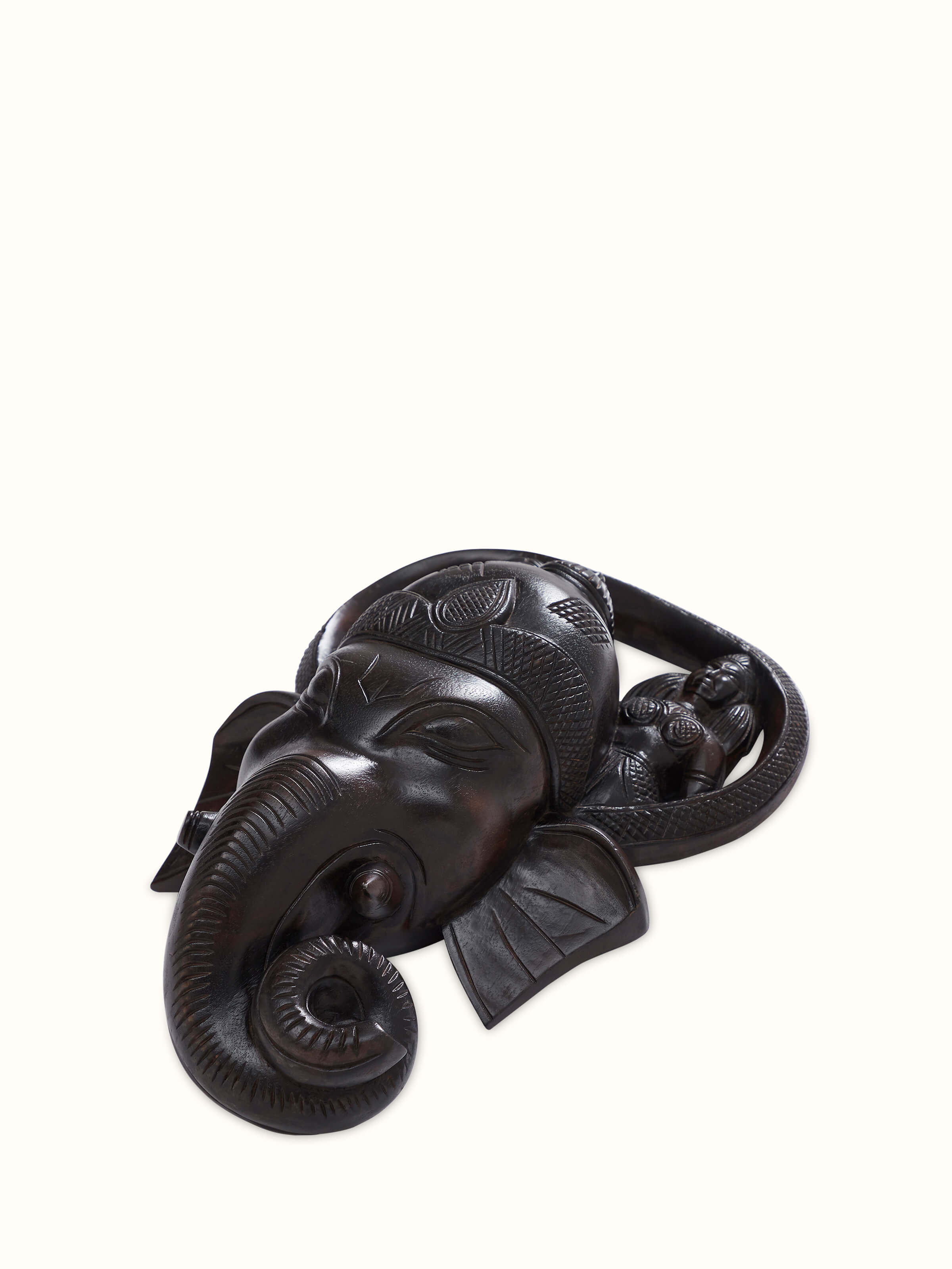 Angled view of Kushmandi Ganesha Wall Mask