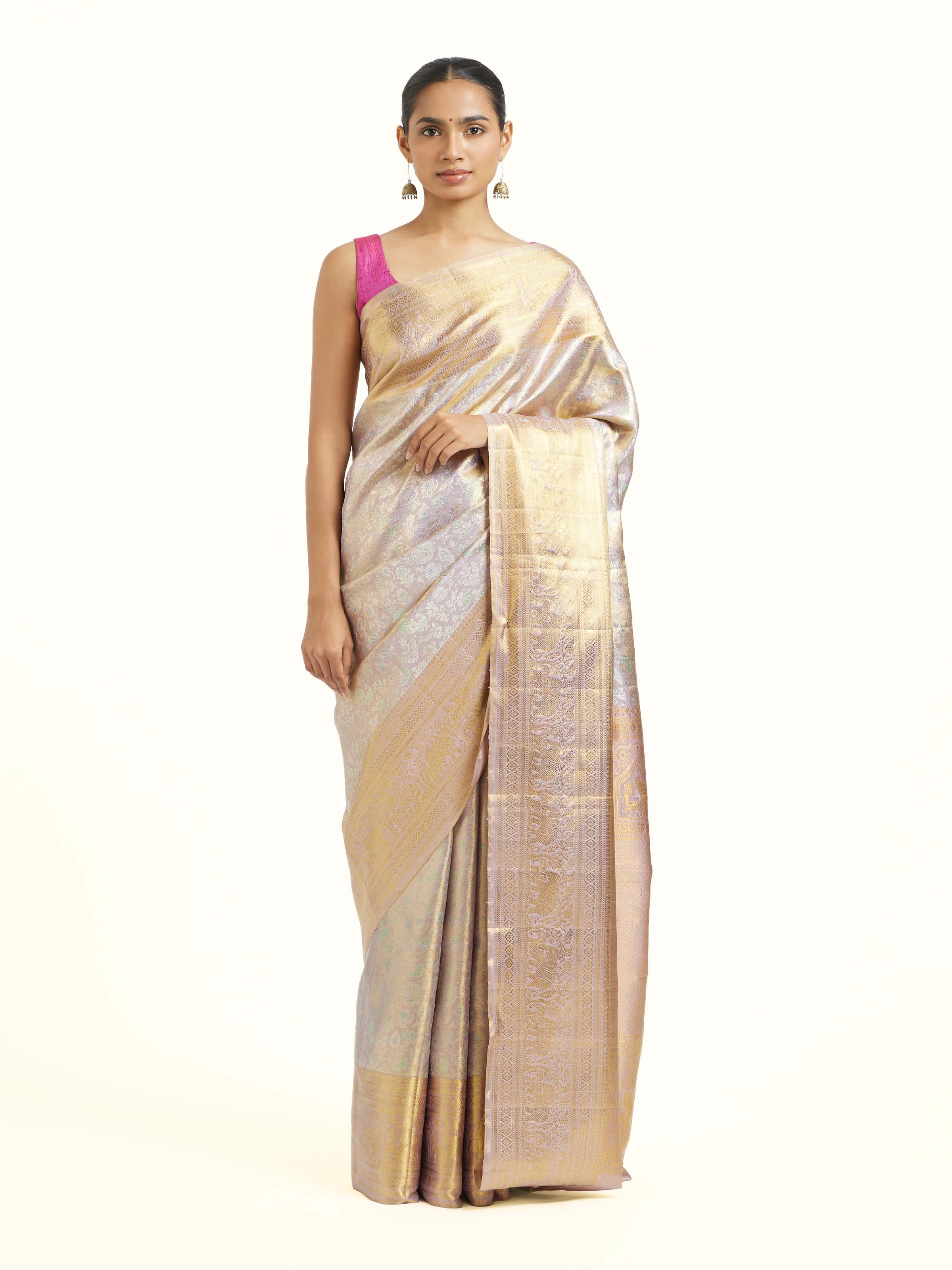 Front view of silver silk Kancheepuram saree with rich zari motifs