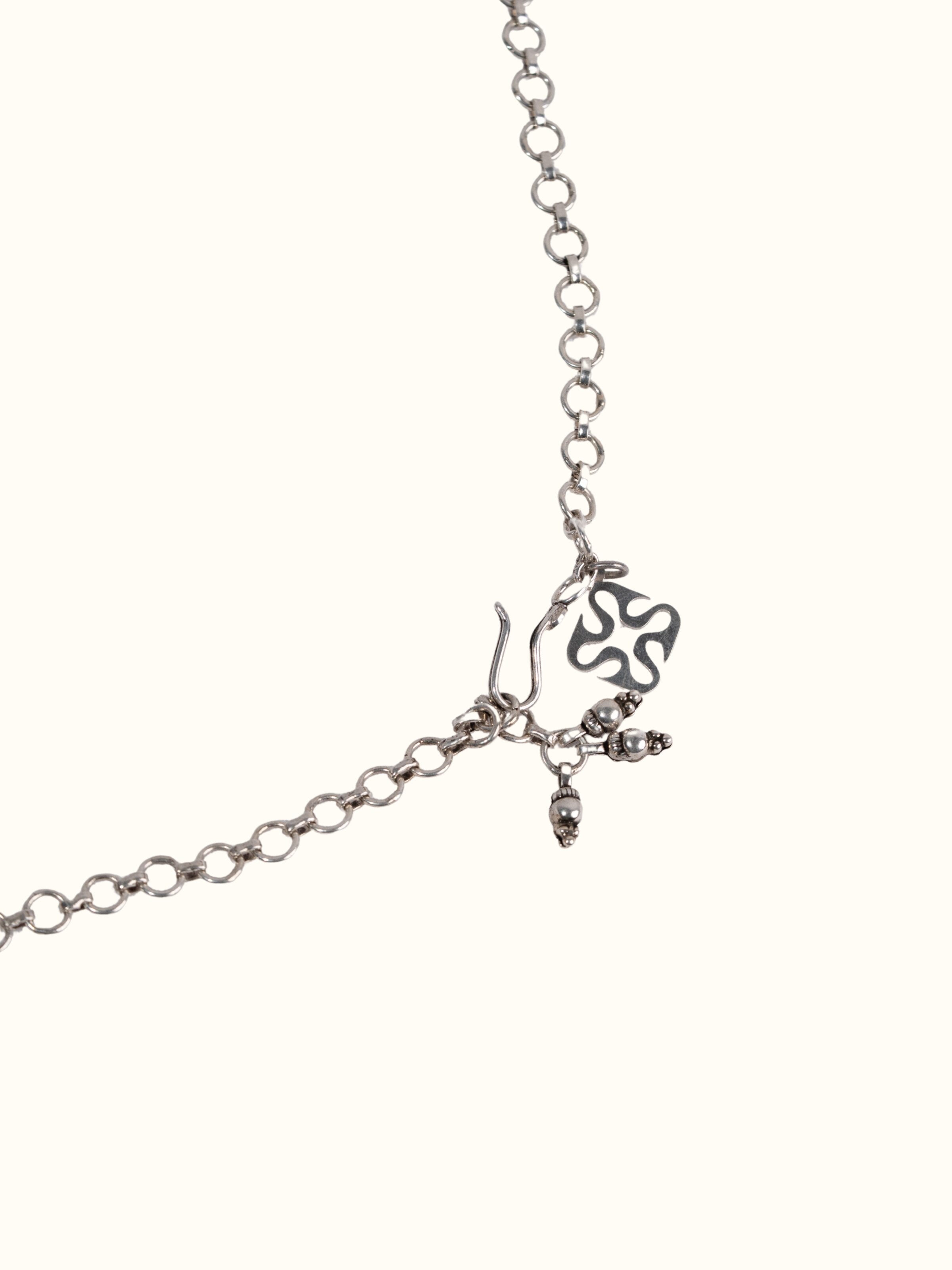 Detail shot of silver smithing collar necklace