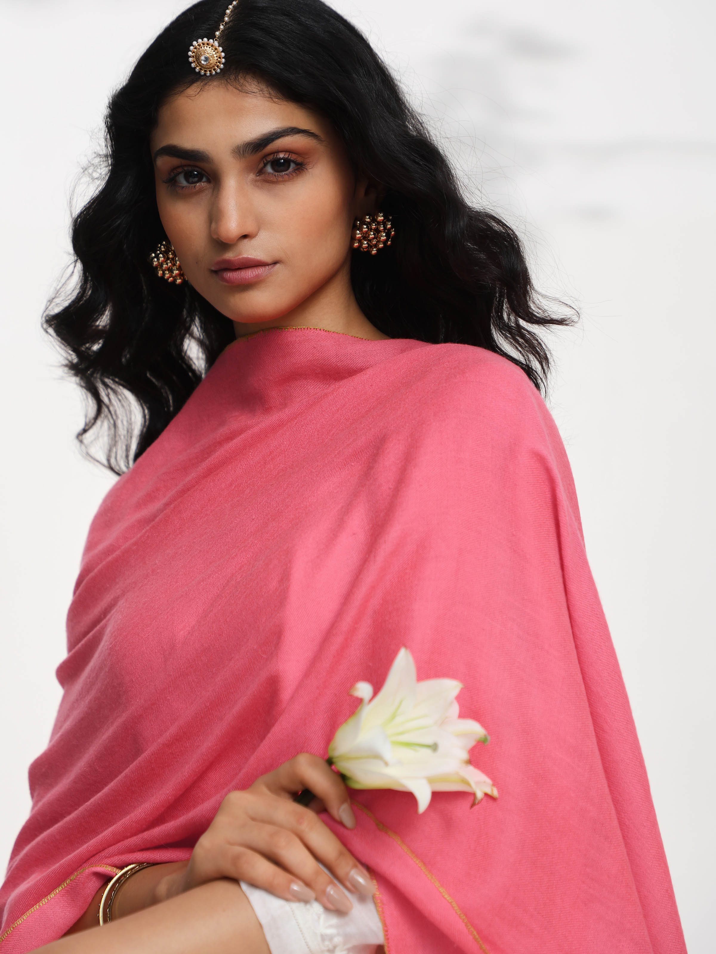 Detail view of coral cashmere kaaj embroidered handwoven stole showing fabric texture and kaaj work