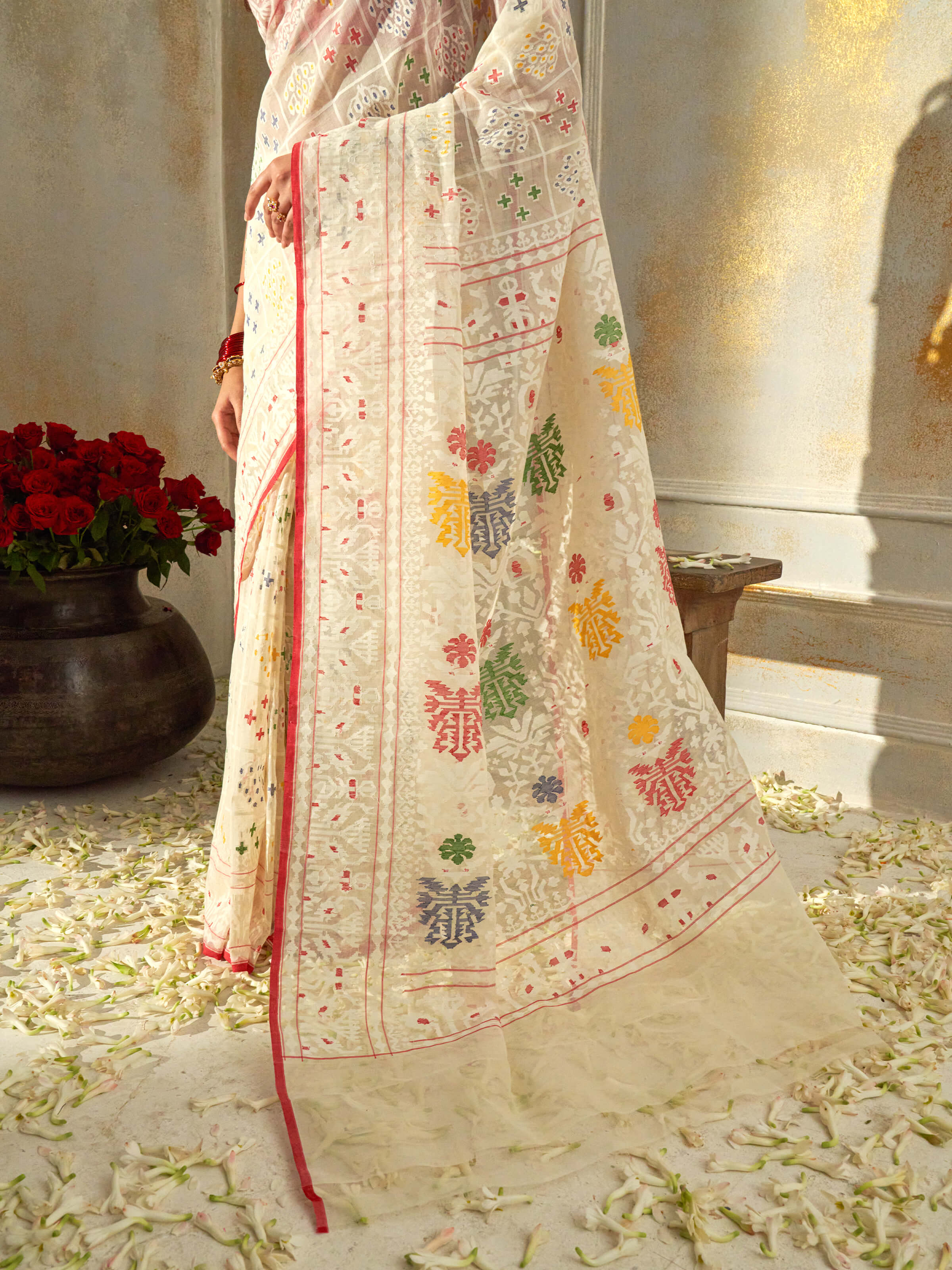 Detail view of white cotton Awadh Jamdani saree showing fine jamdani weave and texture