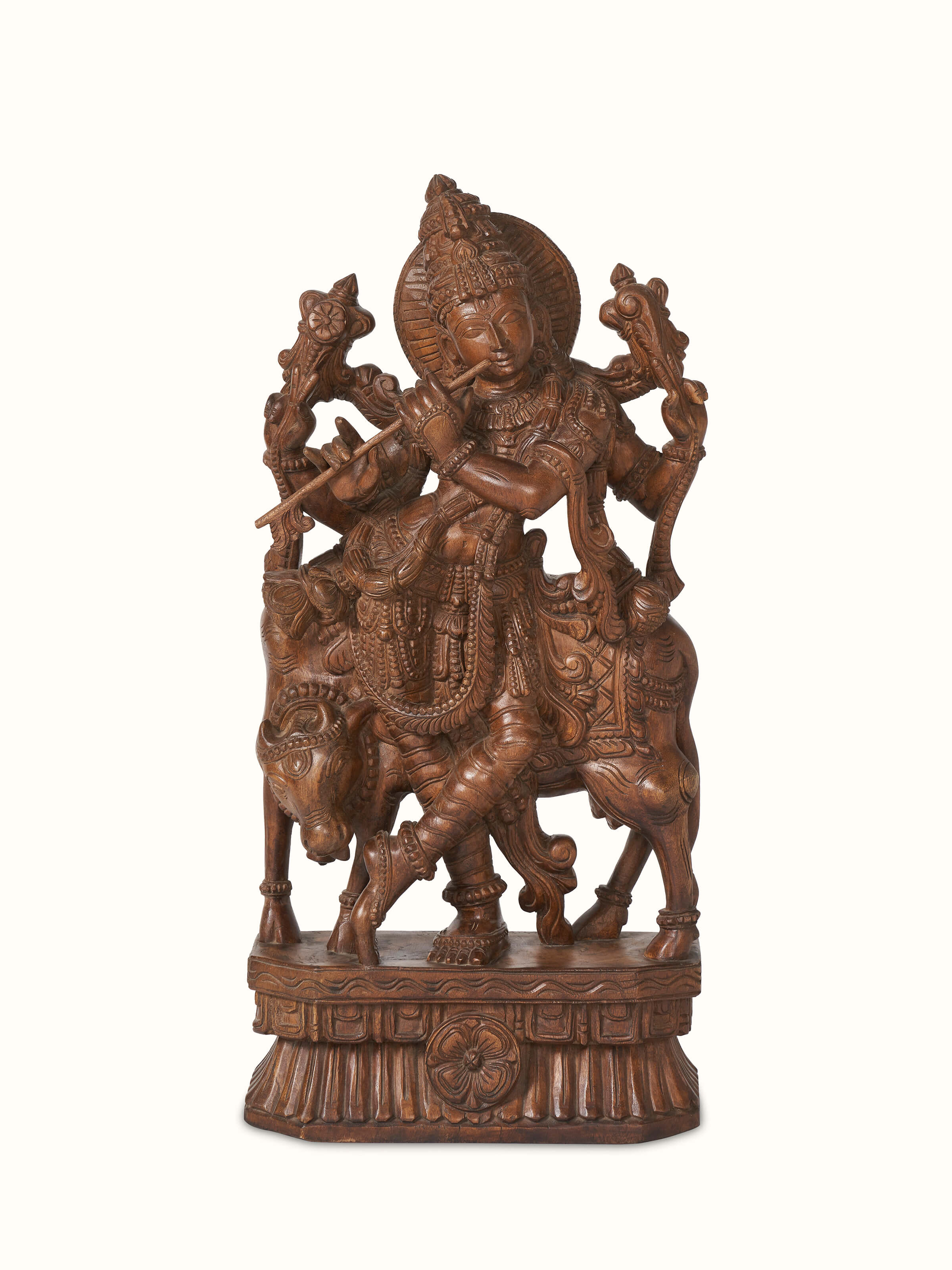 Front view of Ananta Mara Silai carved Vaagai wood Krishna with flute idol, showcasing intricate carving