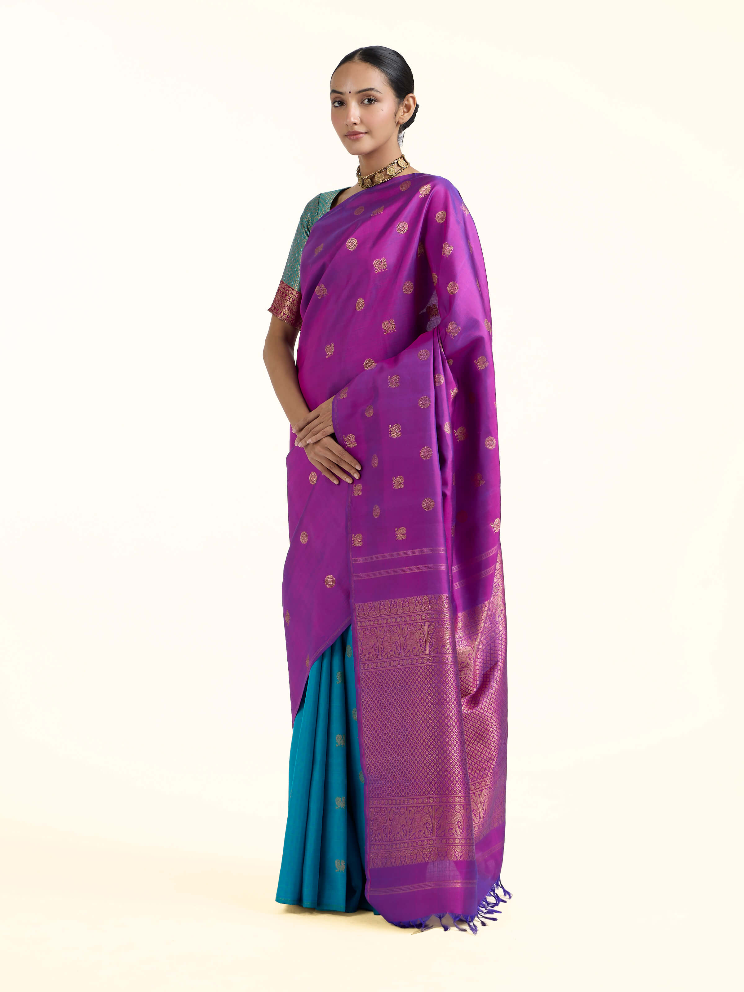 Side view of purple silk Kancheepuram saree showcasing contrast border