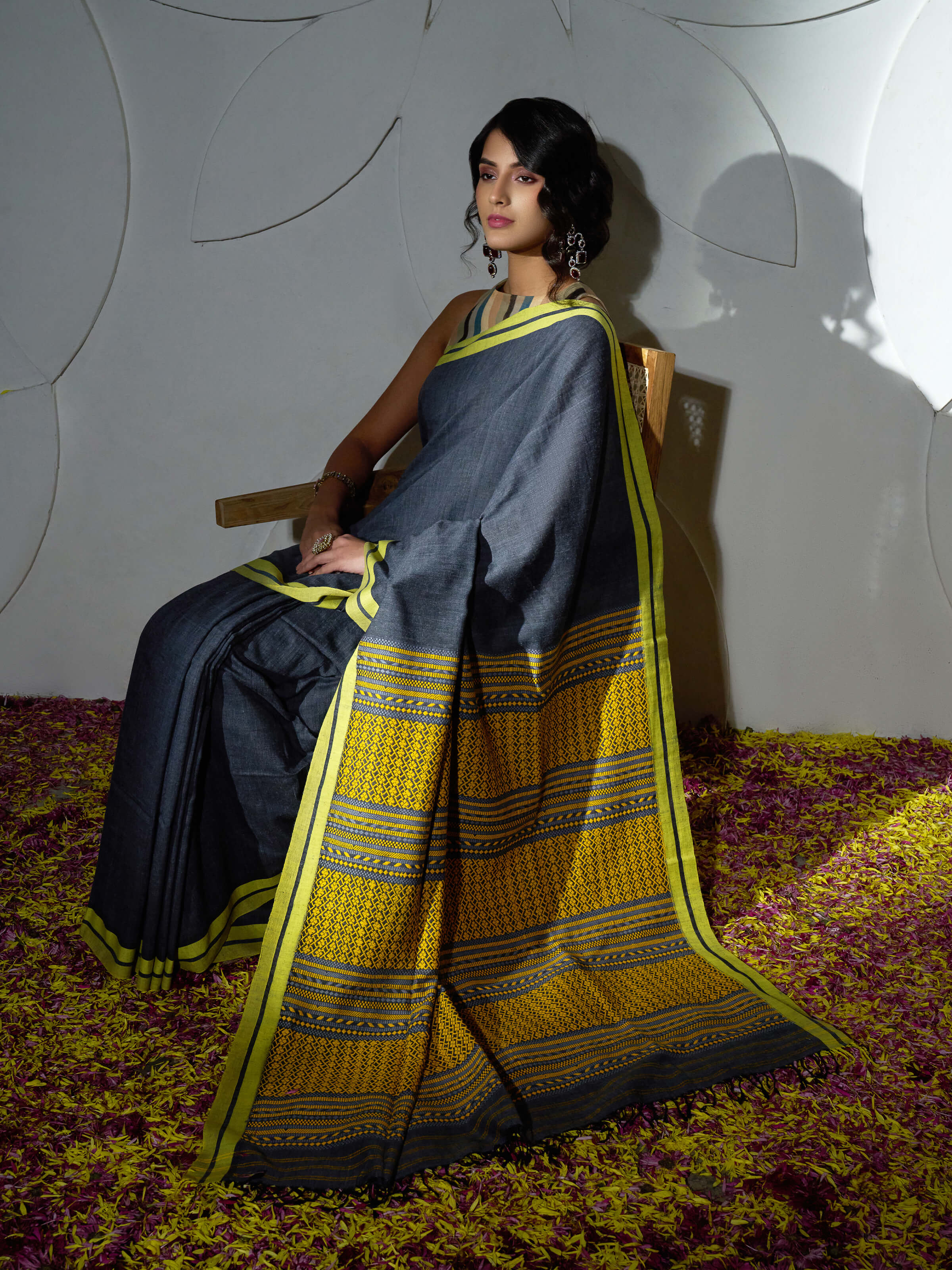 Angled view of grey cotton silk saree highlighting fabric sheen and weave
