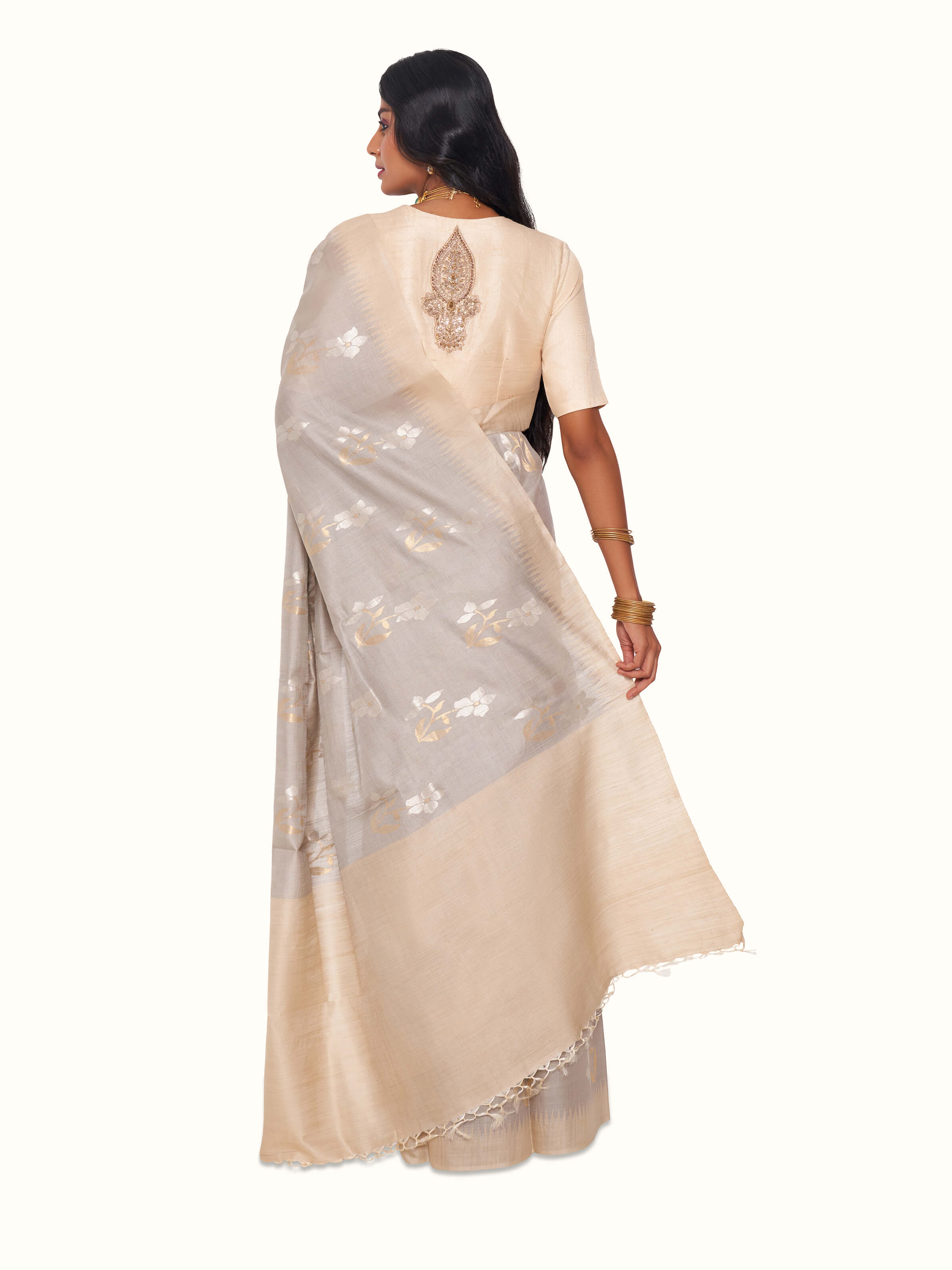Back view of ecru tussar silk saree displaying pallu design