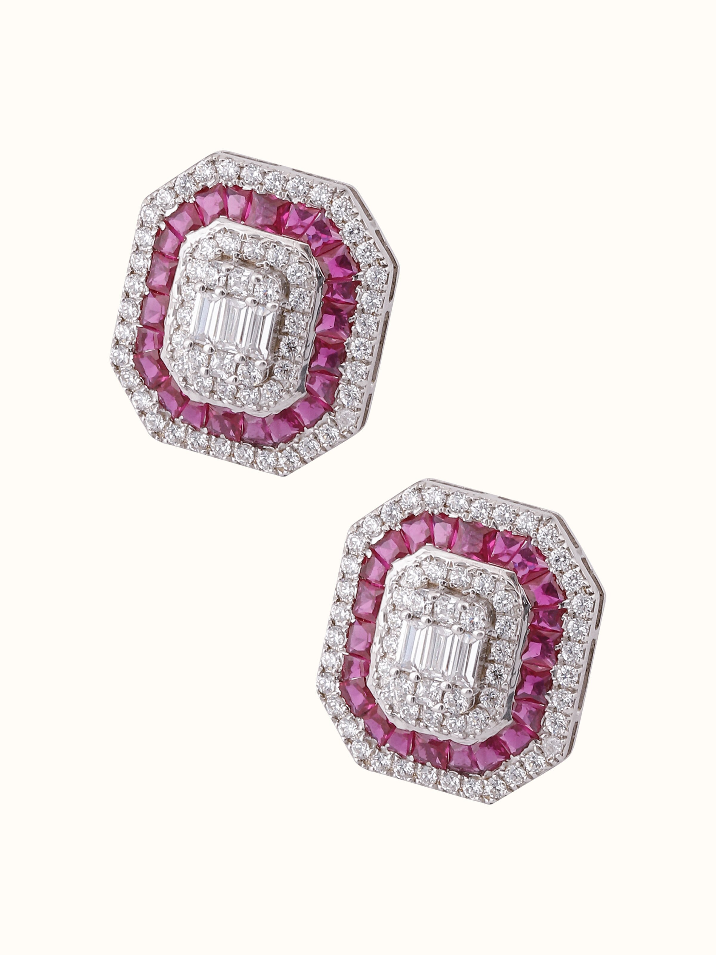 Overhead view displaying circular symmetry and etching on silver studs.