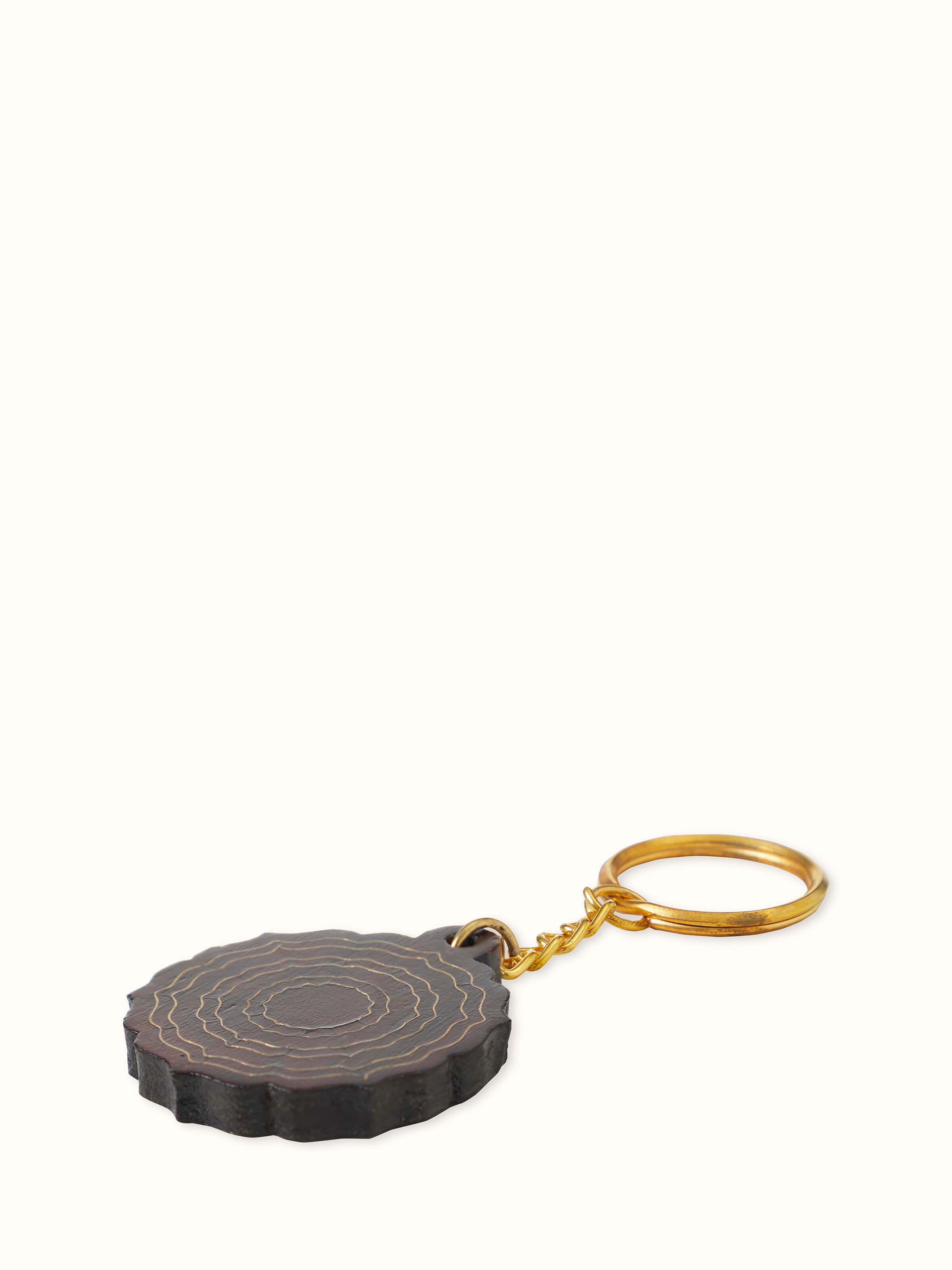 Back view of Tarkashi Sheesham wood & brass keychains set focusing on their smooth finish and design