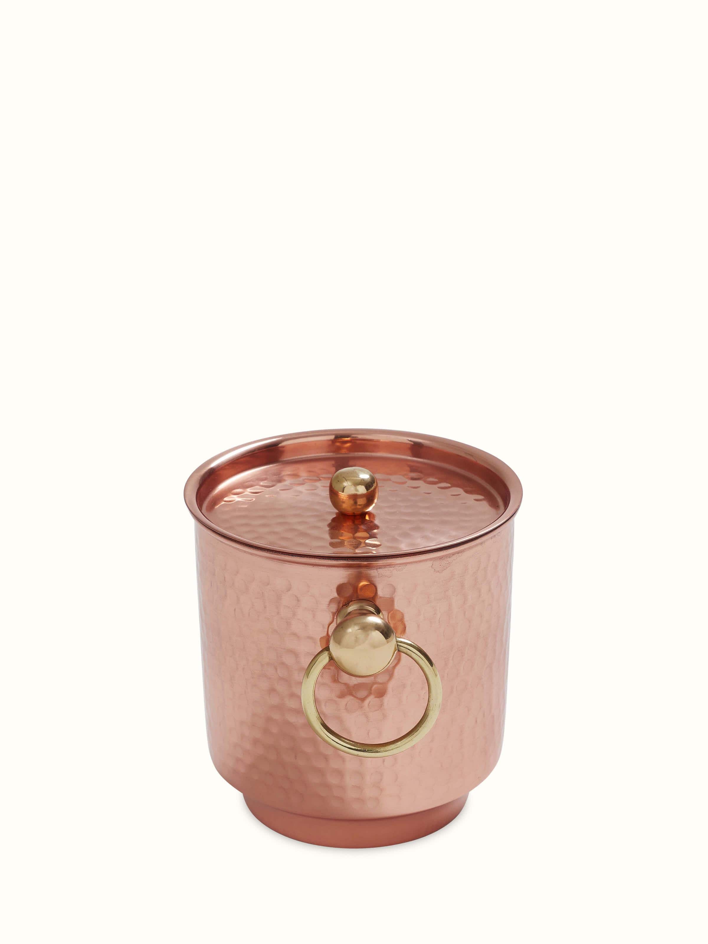 Close-up view of Copper Ice Bucket by Swadesh emphasizing the texture and gleaming copper finish.