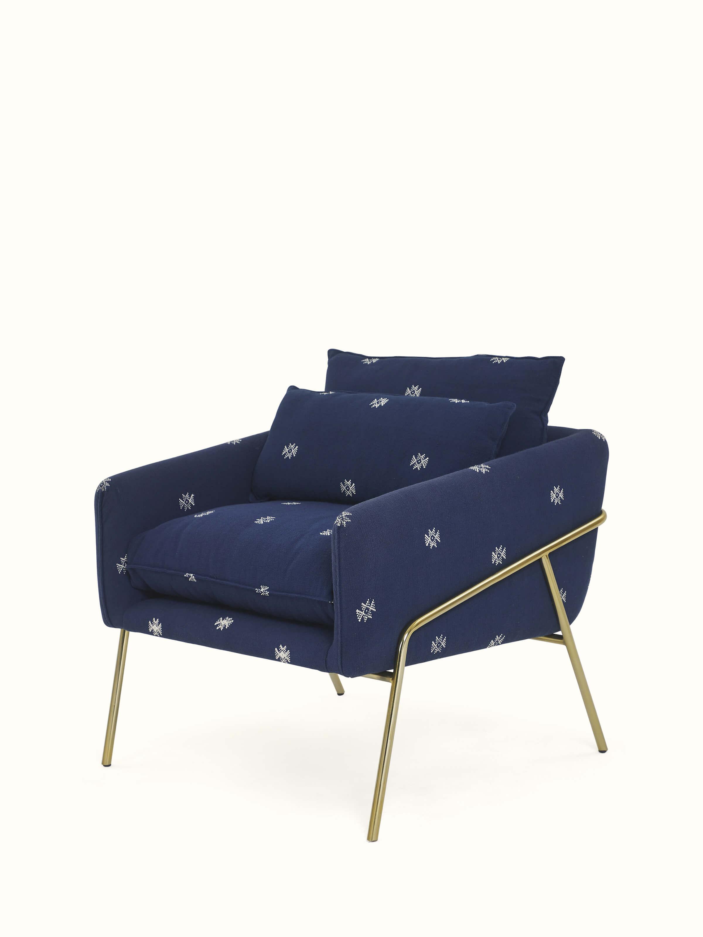 Angled view of Upholstered Metal Armchair emphasizing the ergonomic design and stylish appeal.