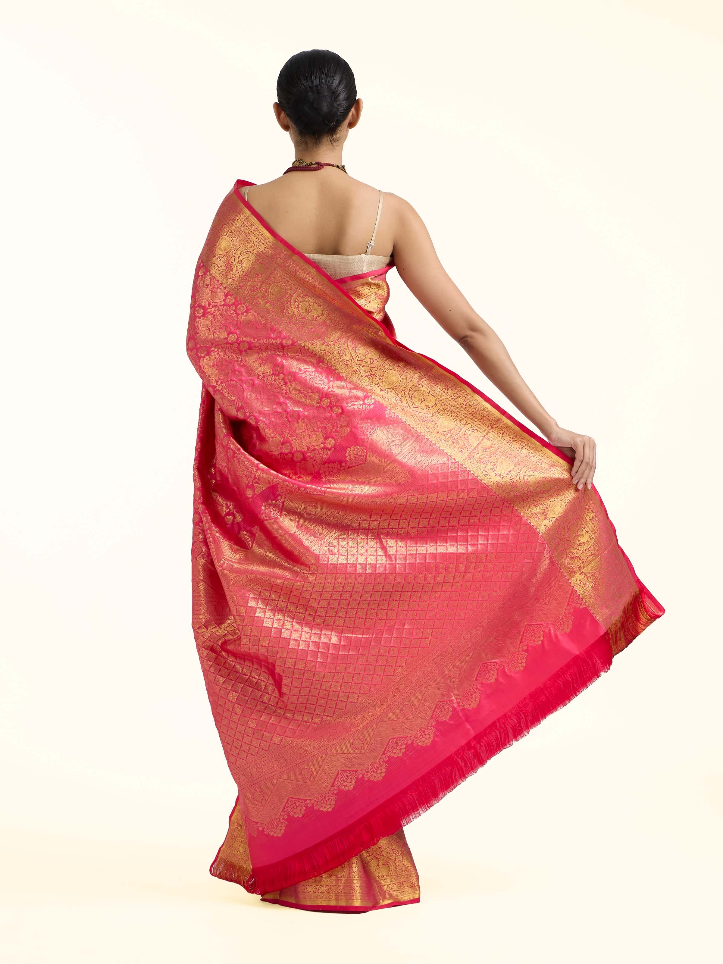 Back view of red silk Kancheepuram saree displaying complete pallu design