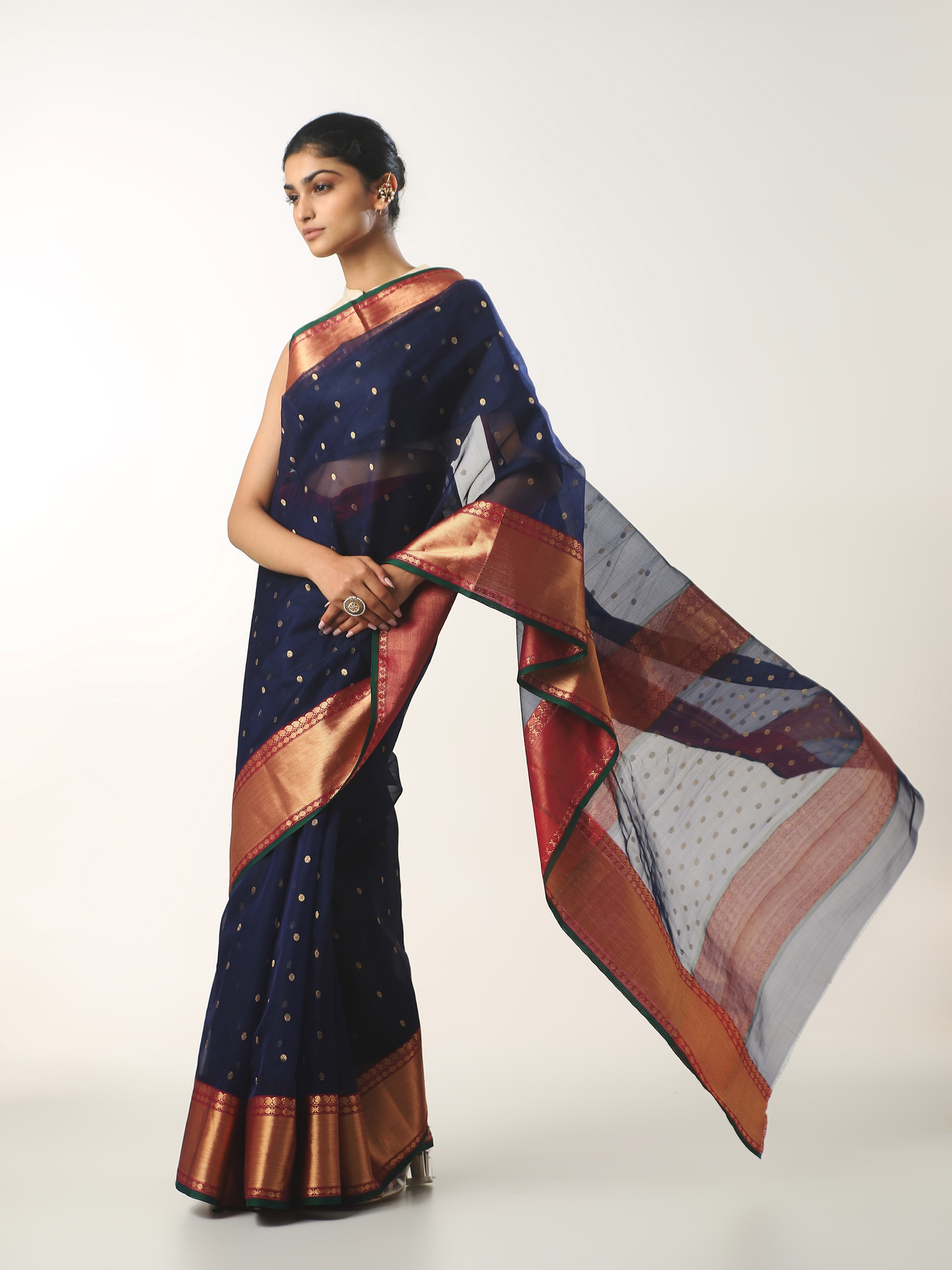 Side view of blue cotton silk Chanderi saree highlighting drape and body fall