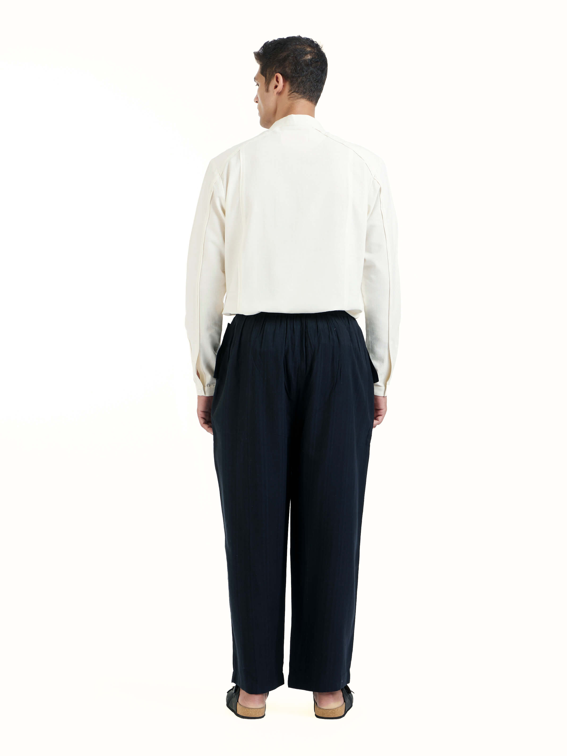 Back view of black silk handloom straight pants with neat fit and finish