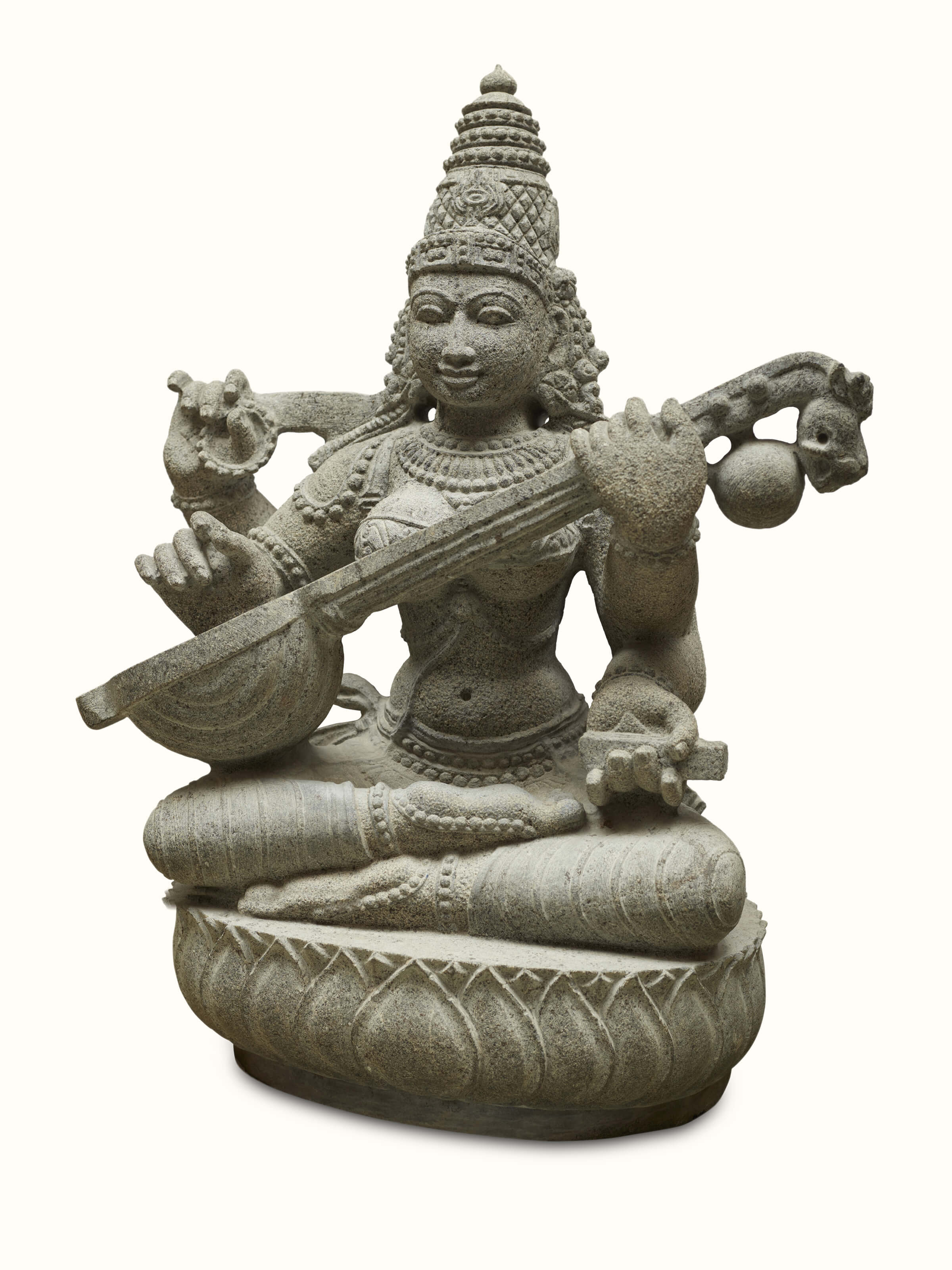 Side angle of the carved stone goddess Saraswati idol, emphasizing the elegant posture and artistry.