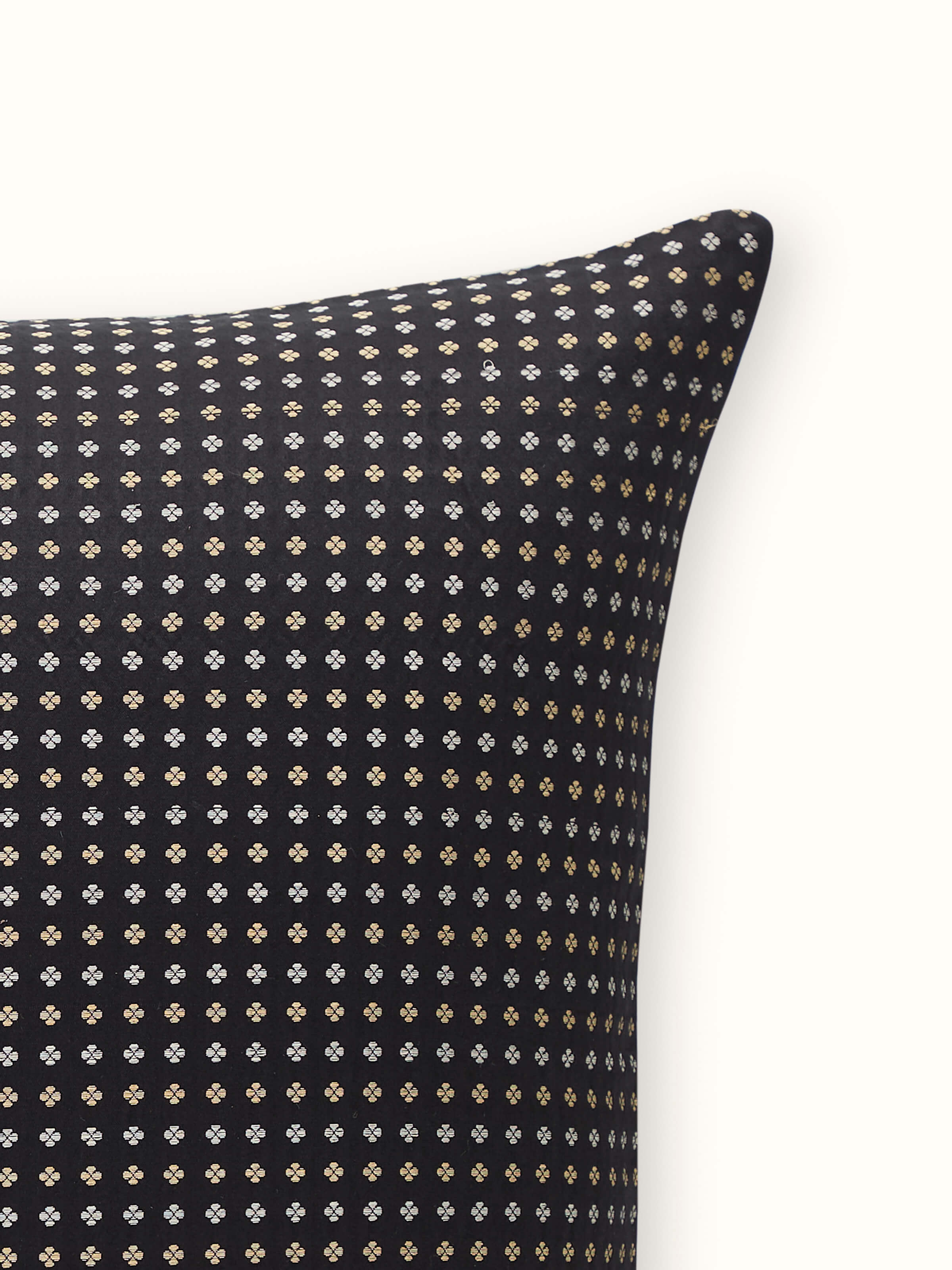 Macro detail of intricate black and gold woven stripes in Banarasi silk cushion cover