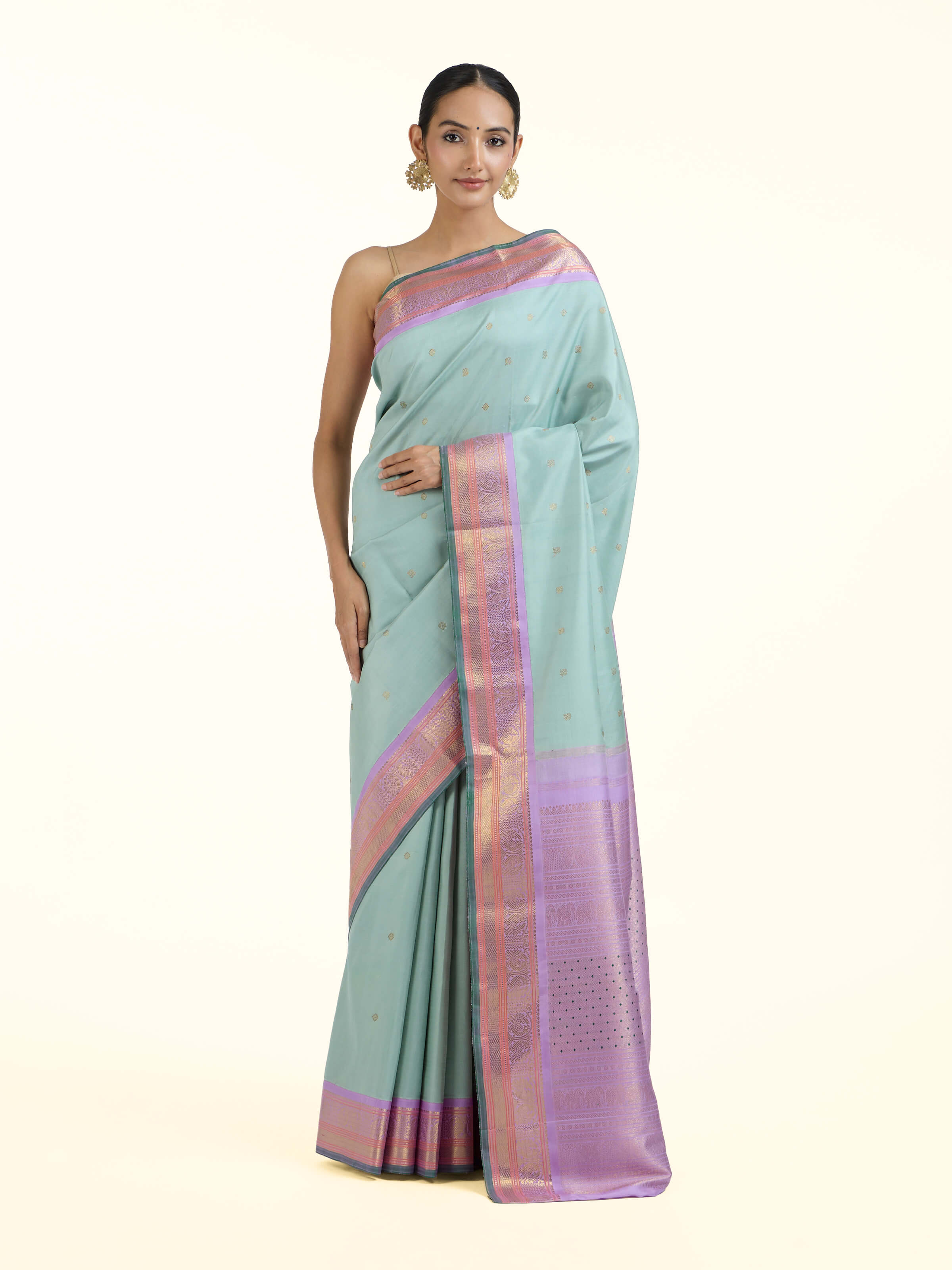 Front view of light blue silk Kancheepuram saree with rich zari woven motifs