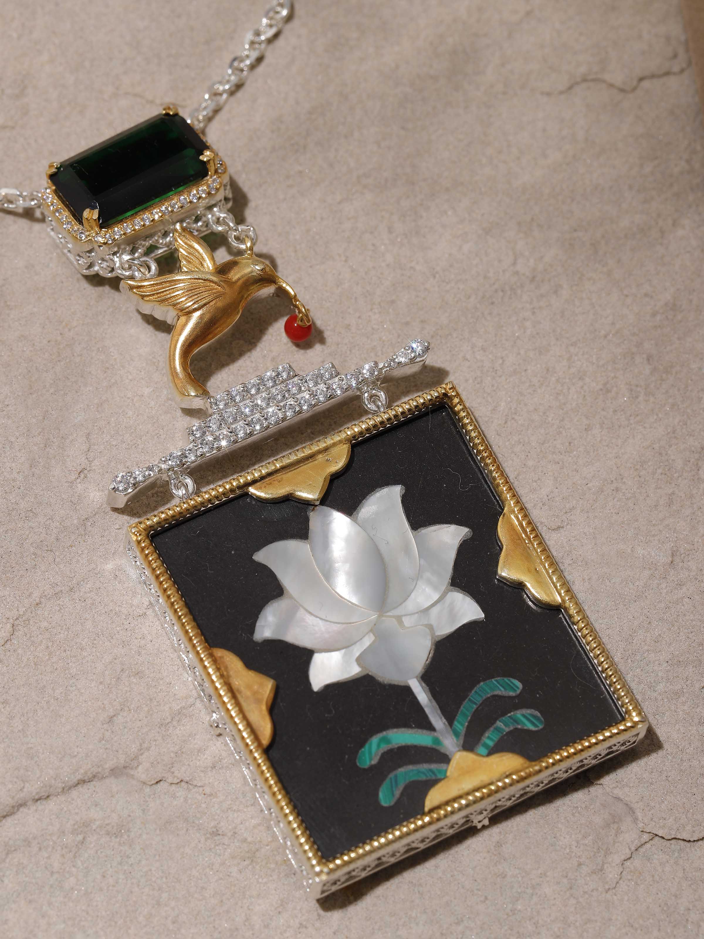 Artistic angled shot capturing the pendant’s delicate pattern and chain details