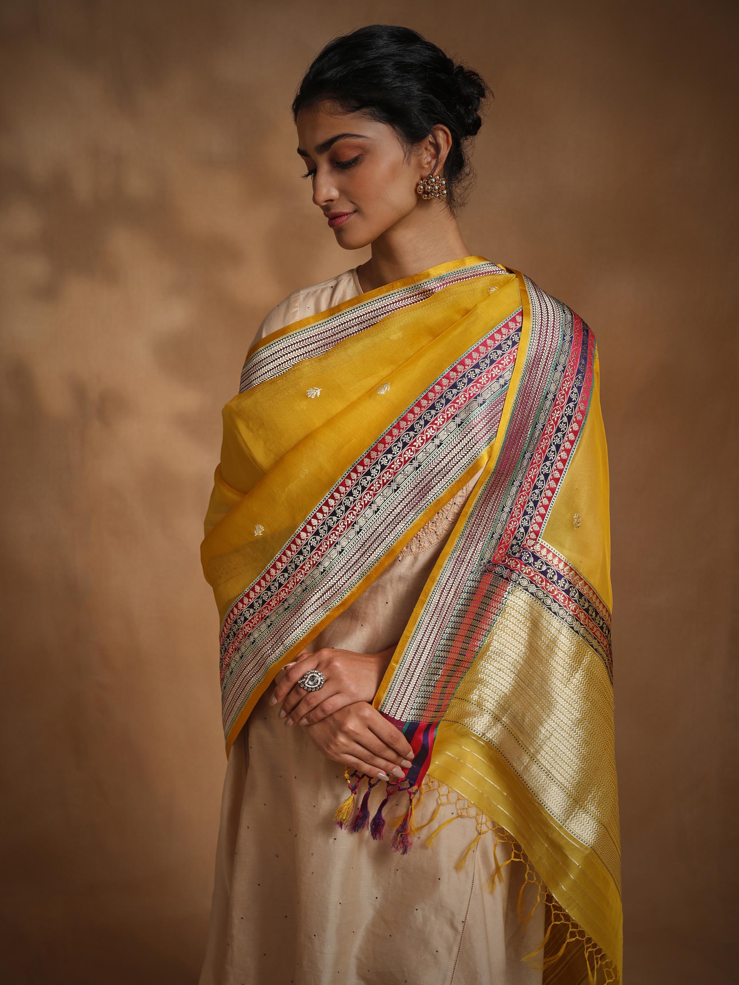 Close-up of traditional motifs on yellow Banarasi silk dupatta