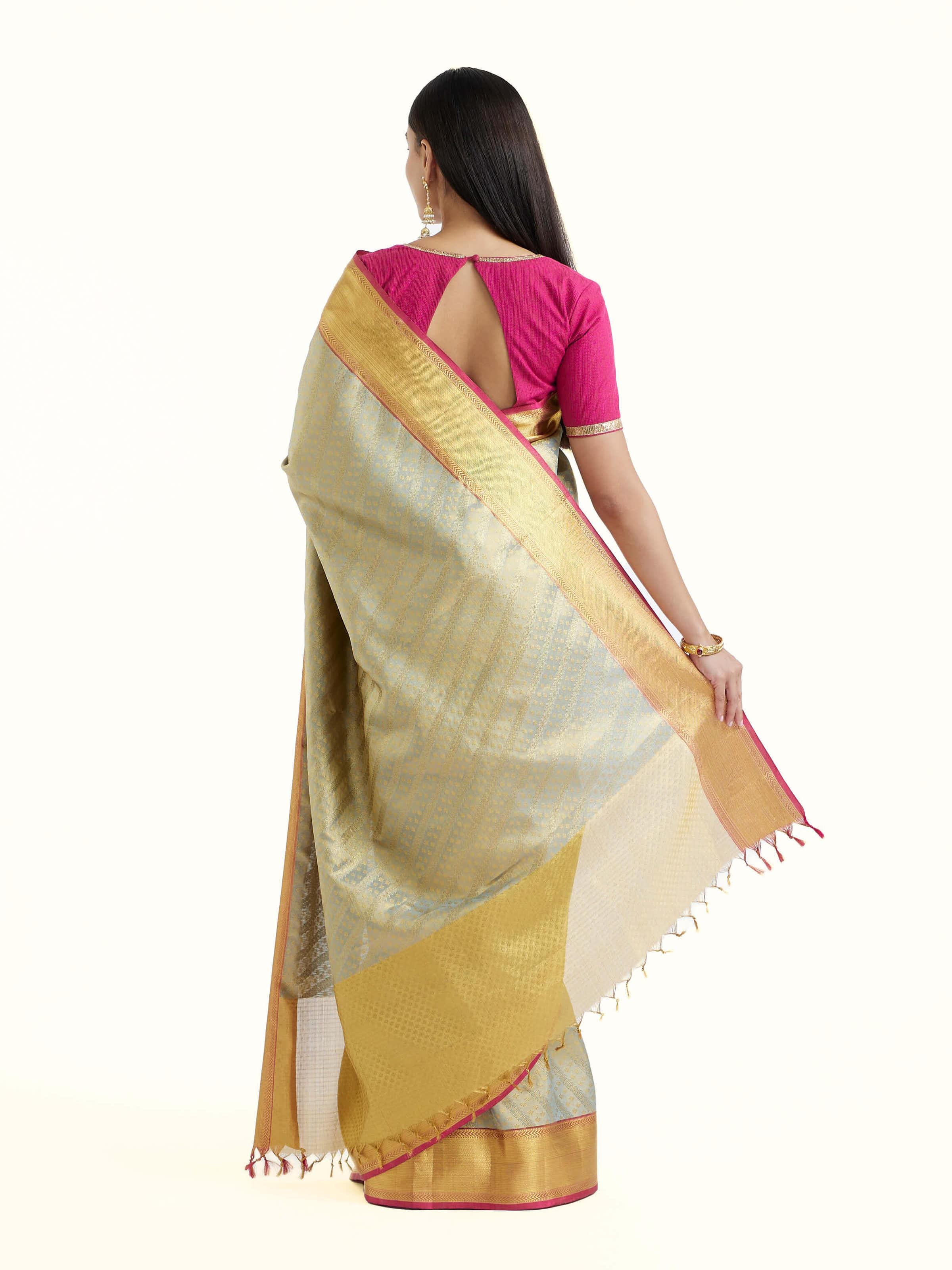 Back view of pista silk Kancheepuram saree displaying grand pallu