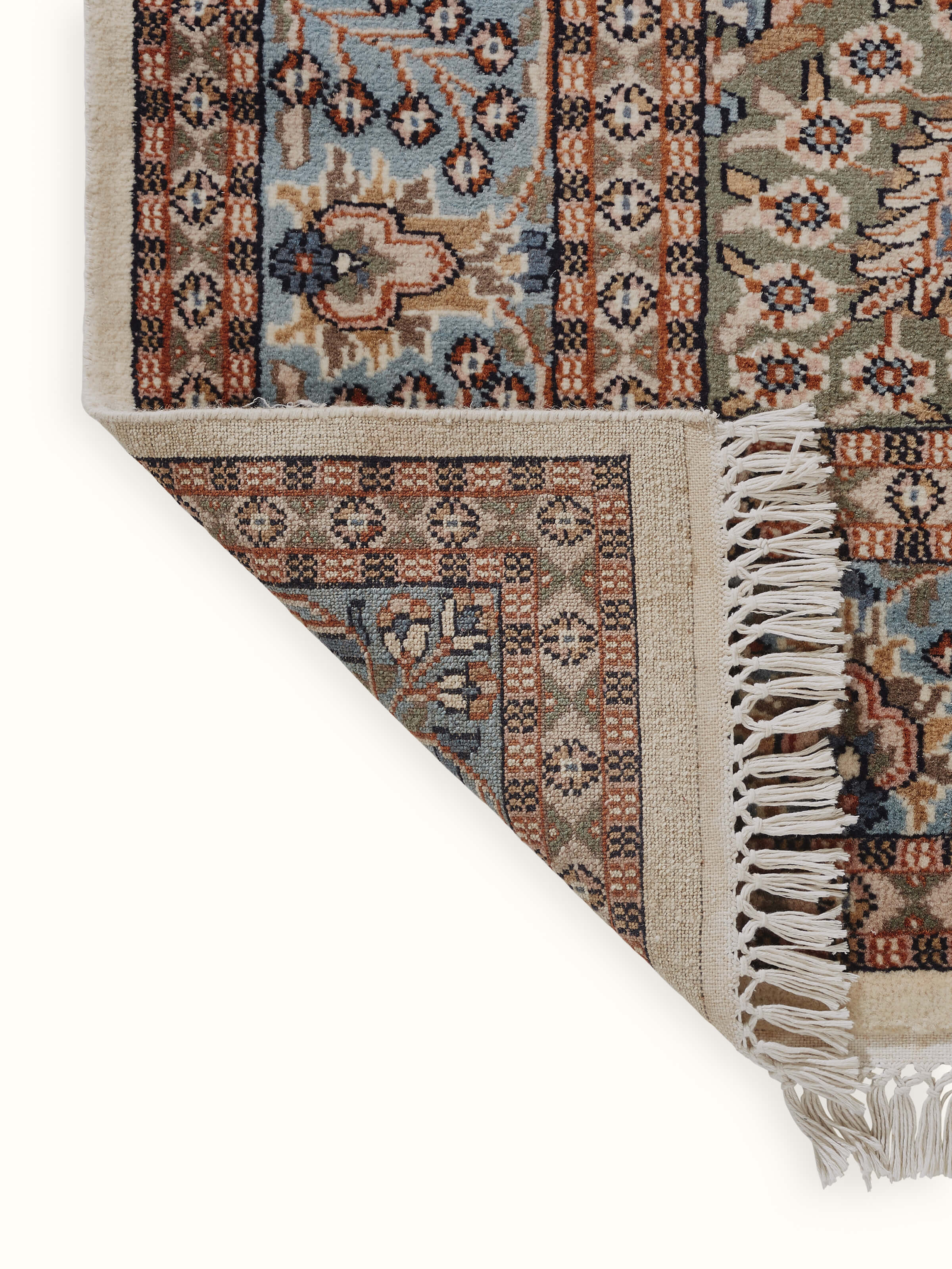 The back view of the rug displays tight knots and a high-quality wool weave, a hallmark of Indian hand-knotting.