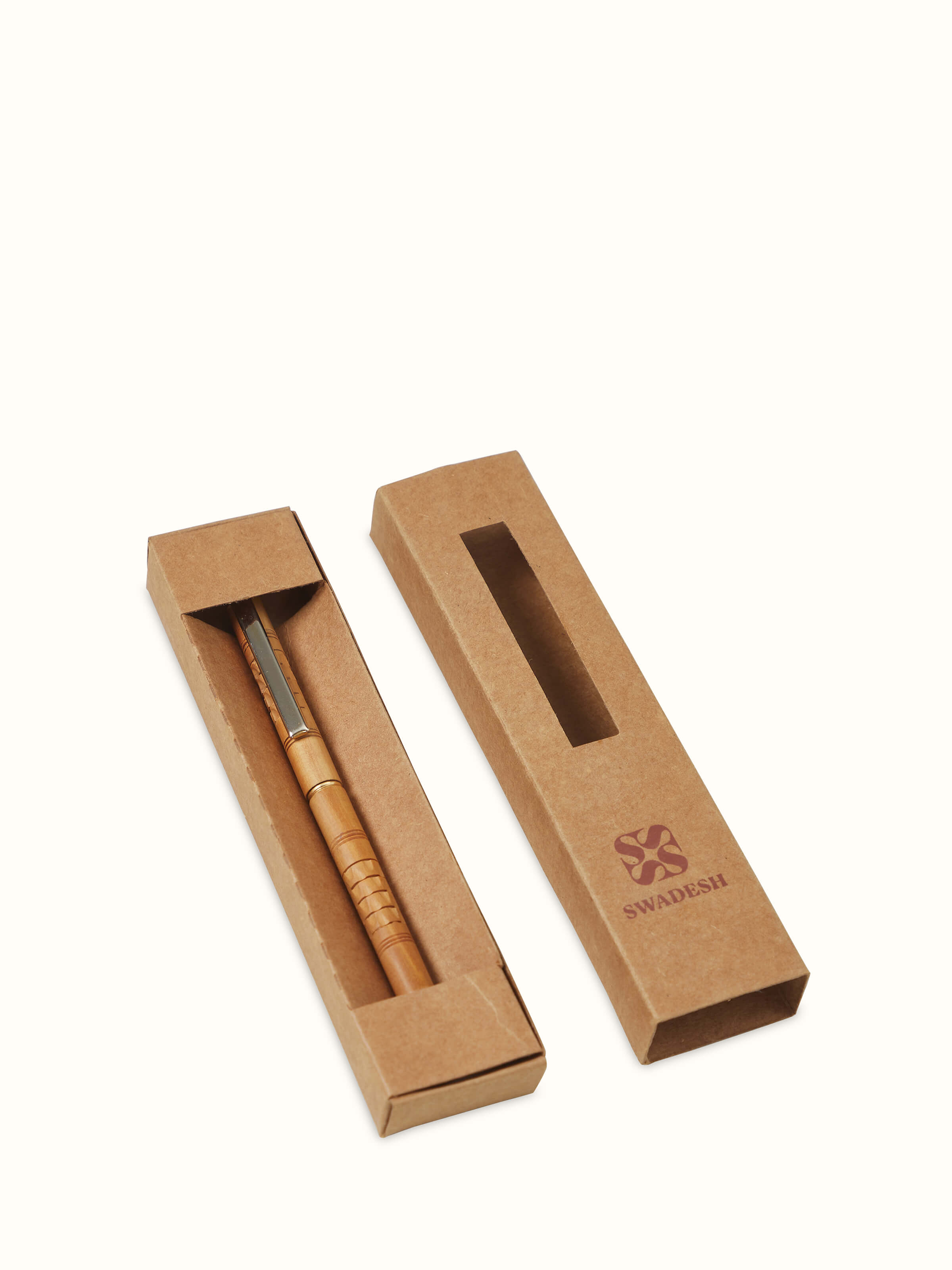 Close-up view of Carved Sandalwood Pen by Swadesh highlighting the detailed craftsmanship and fine texture of the sandalwood.