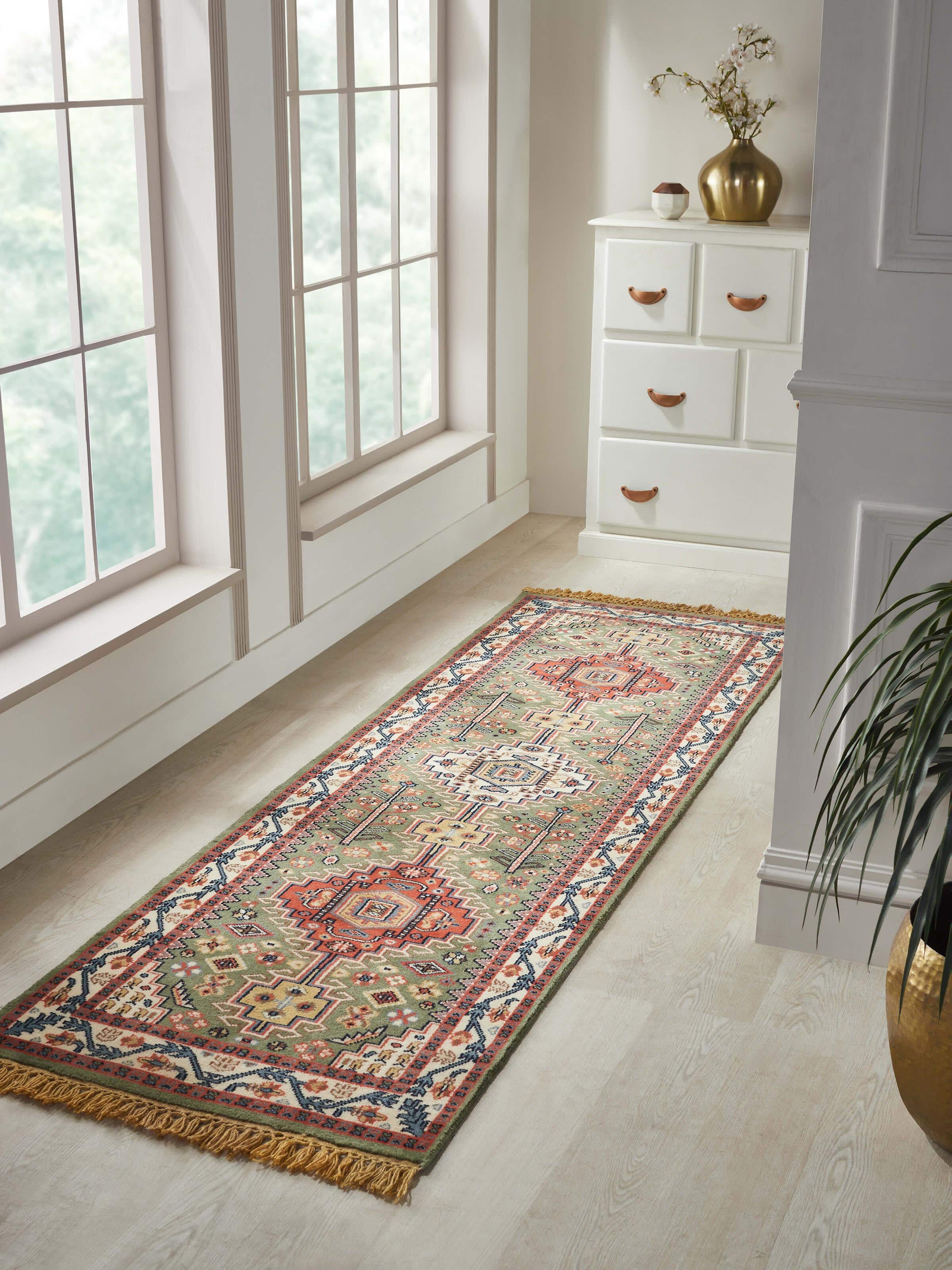 Close-up of Persian Kazak light green Gwalior wool hand-knotted runner, highlighting the detailed hand-knotted craftsmanship