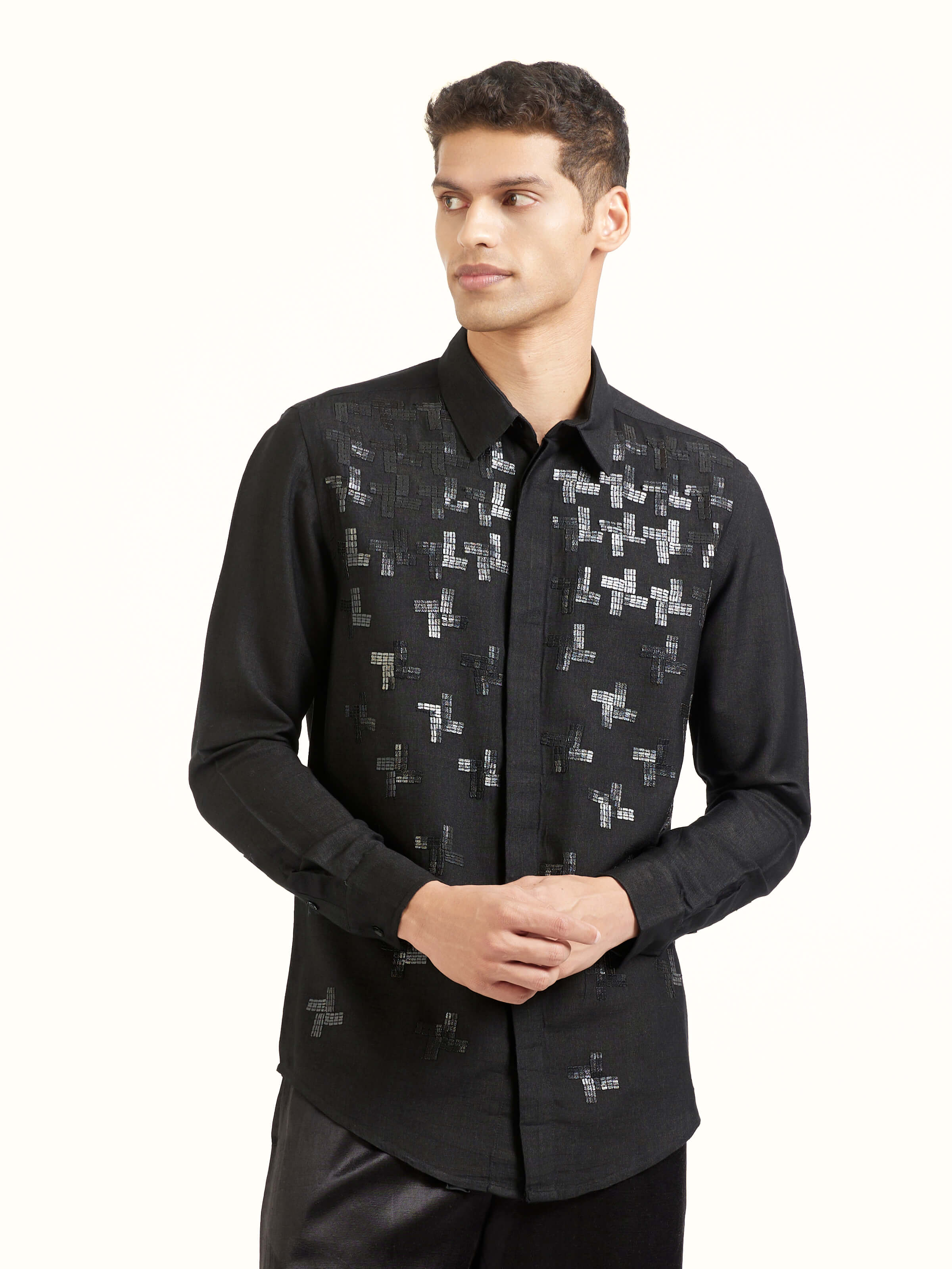 Angled view of black hand embroidery shirt highlighting embroidery work