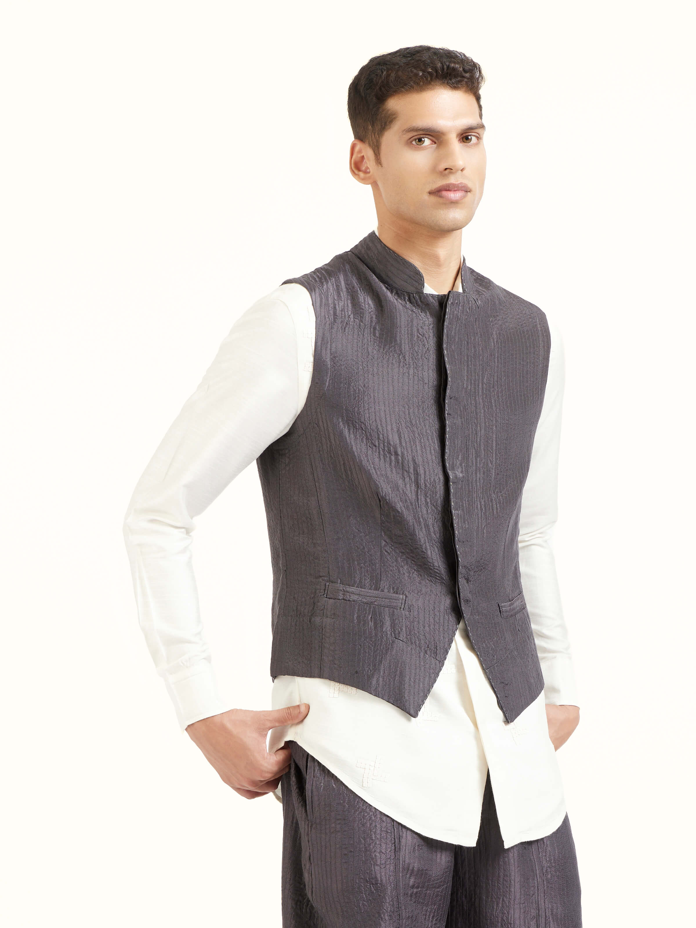 Angled view of grey silk handloom silk ethnic jacket highlighting fabric sheen