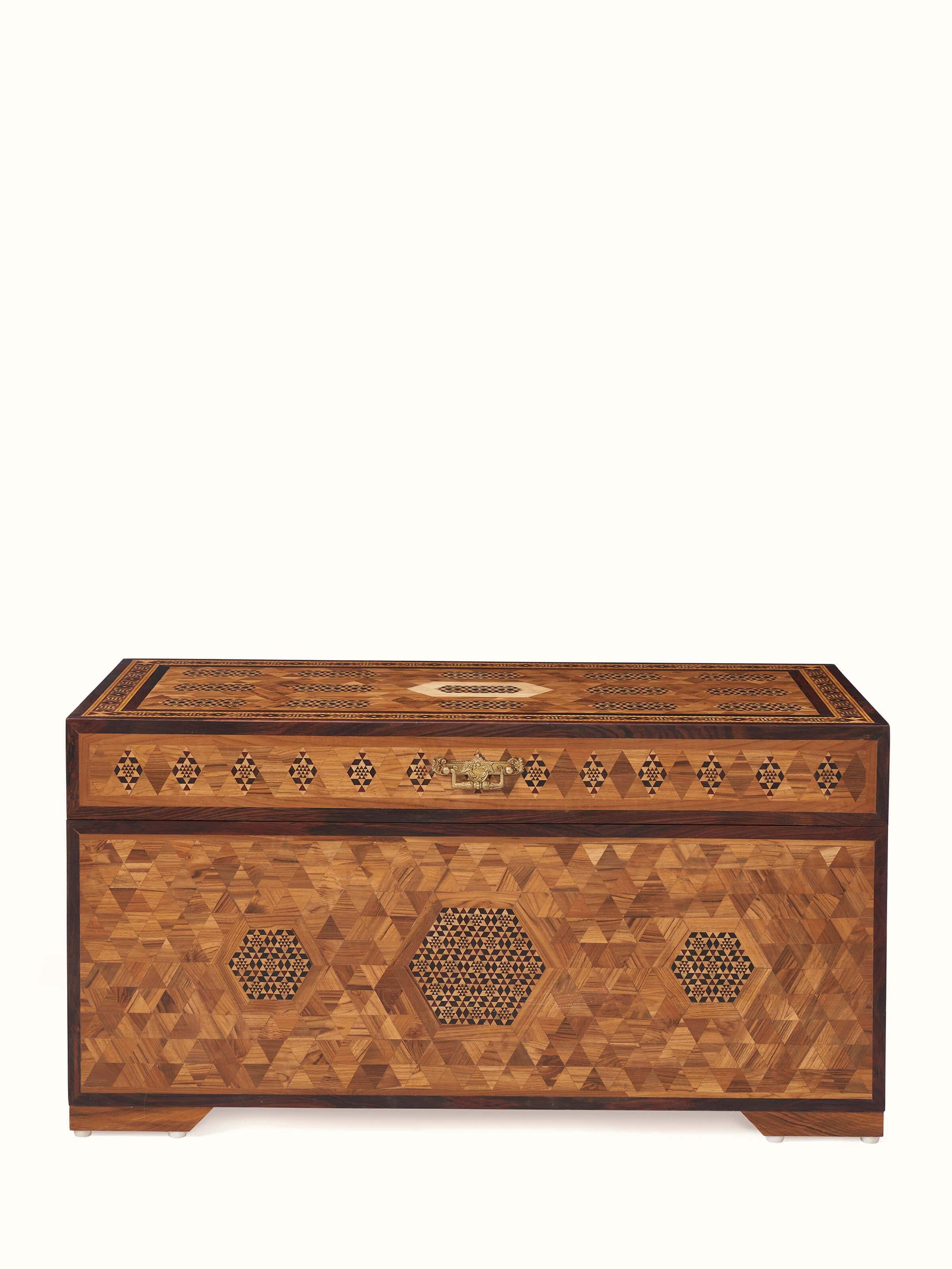 Front view of teak wood marquetry trunk with intricate inlaid designs, showcasing its elegant craftsmanship and detail.