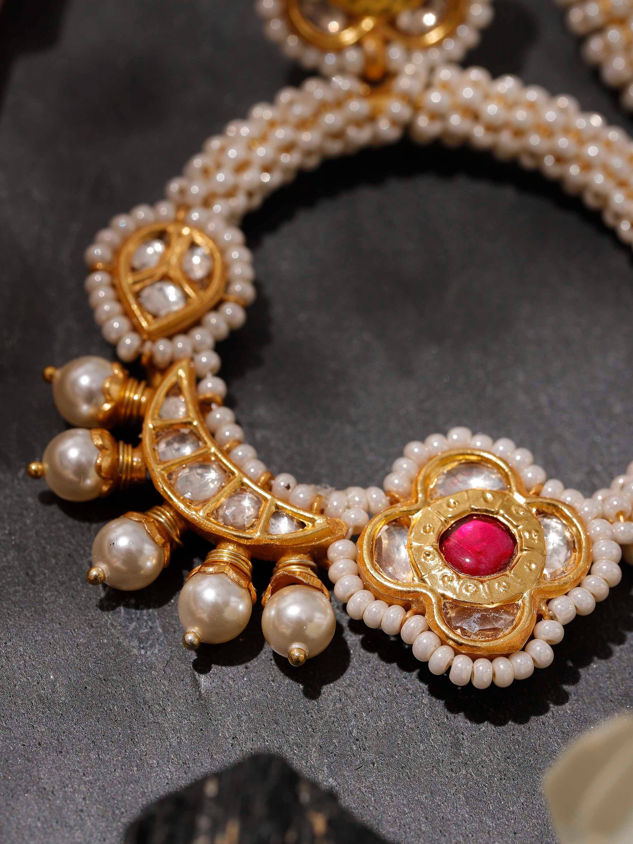 Detail shot of Silver Smithing chandbalis showing fine silverwork and traditional patterns up close.