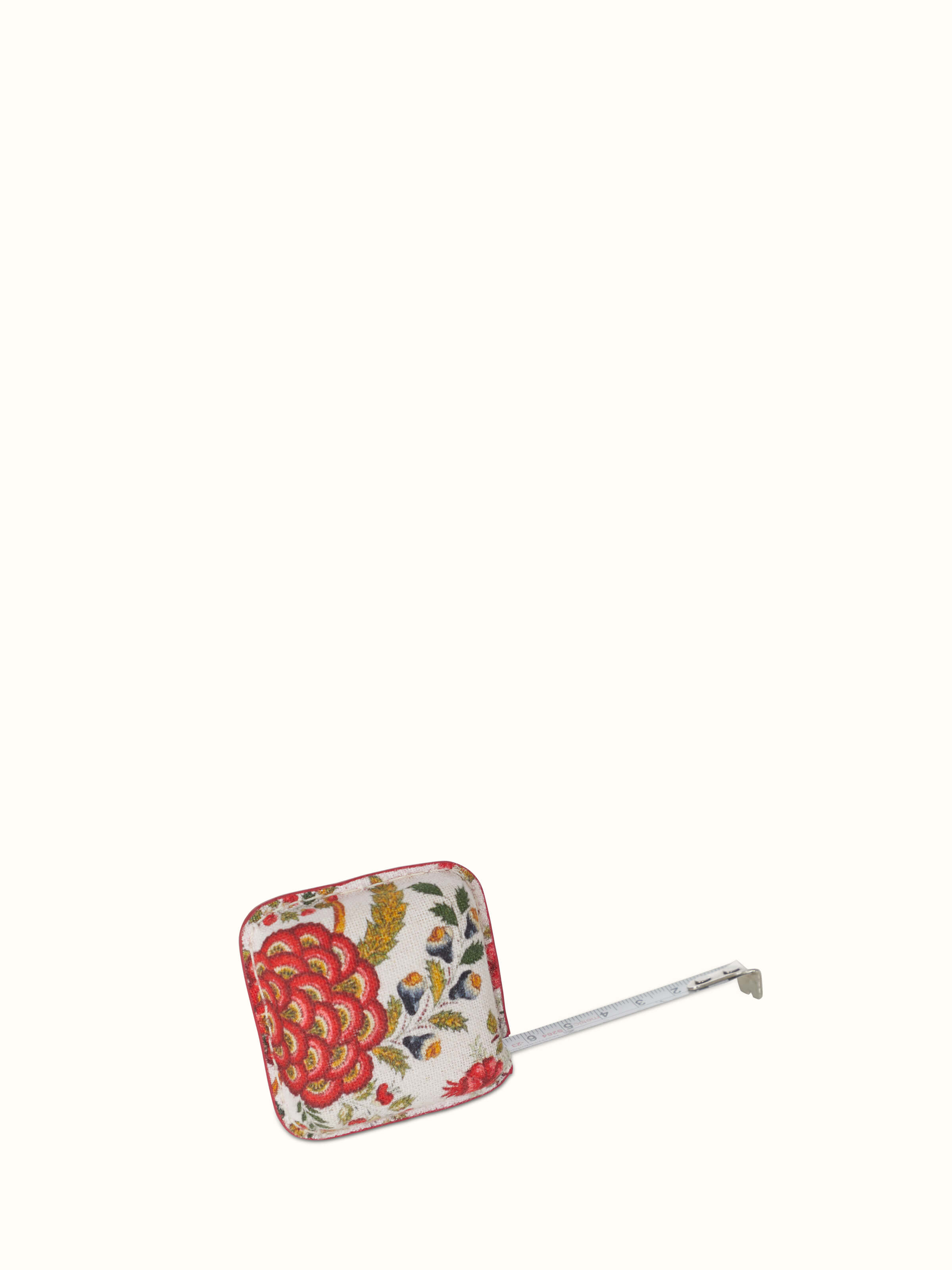 Close-up of Leather Measuring Tape in Red color focusing on the leather texture