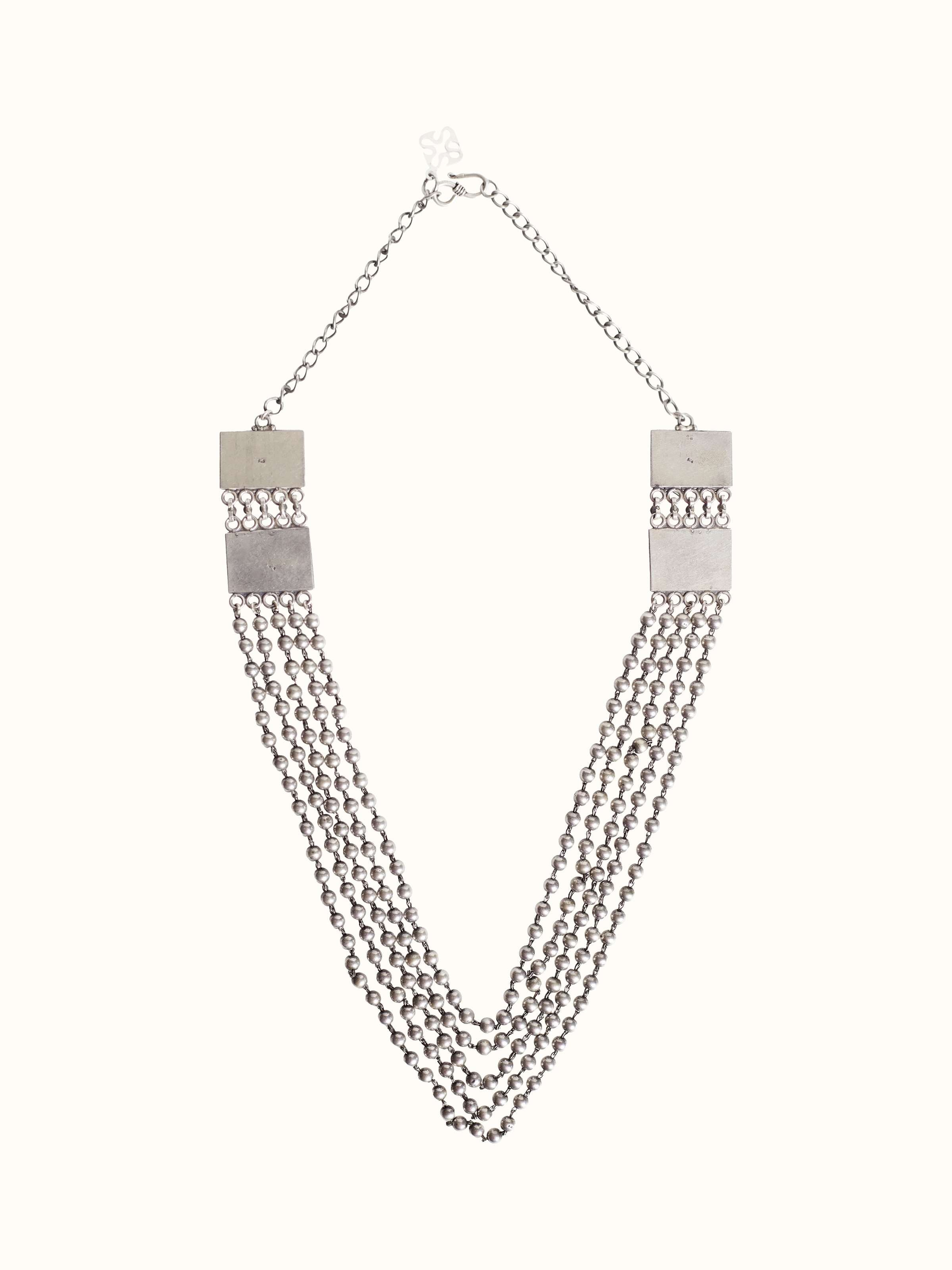 Back side view of silver smithing long necklace