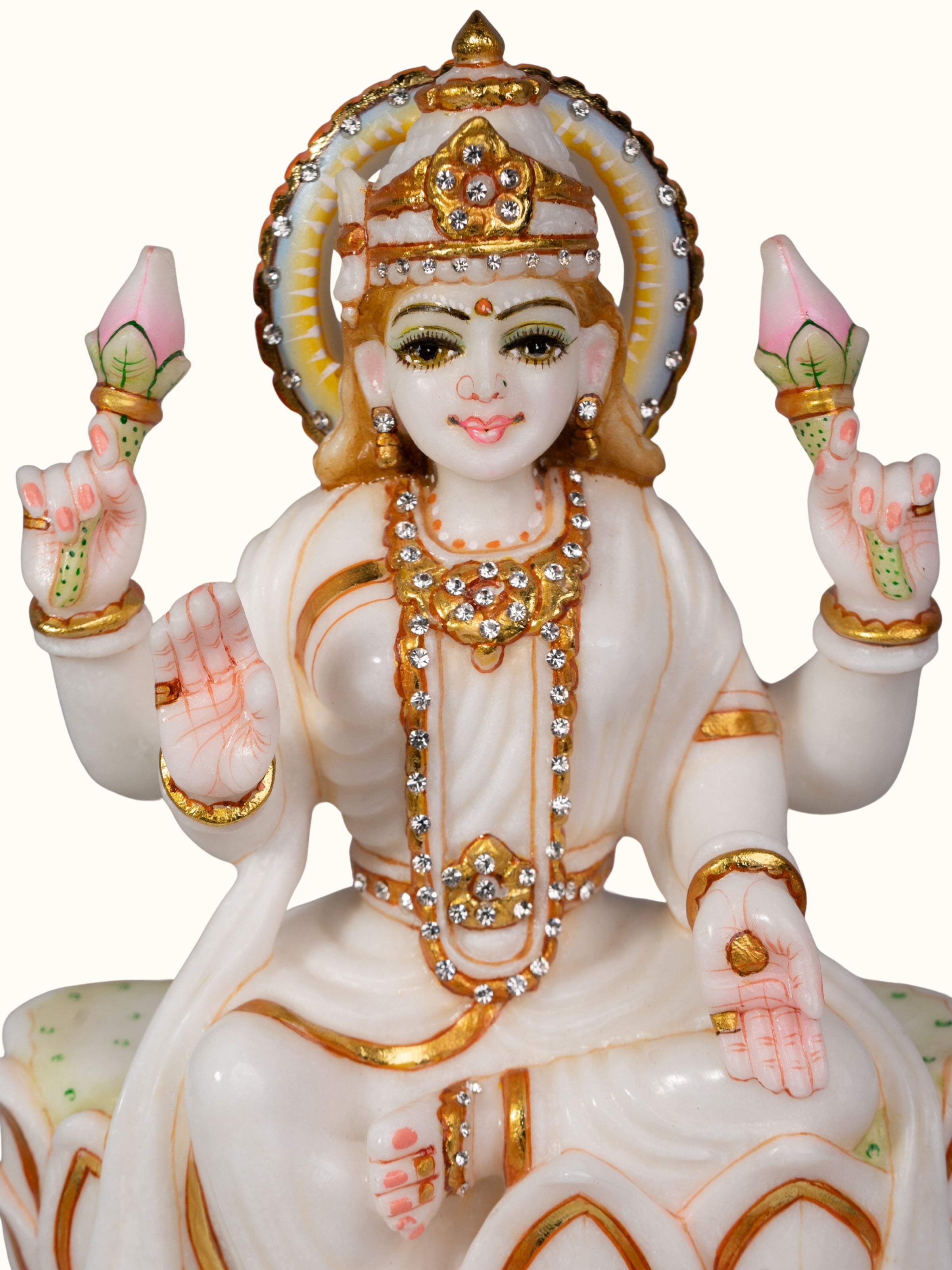 Detail shot of carved marble Lakshmi idol highlighting craftsmanship