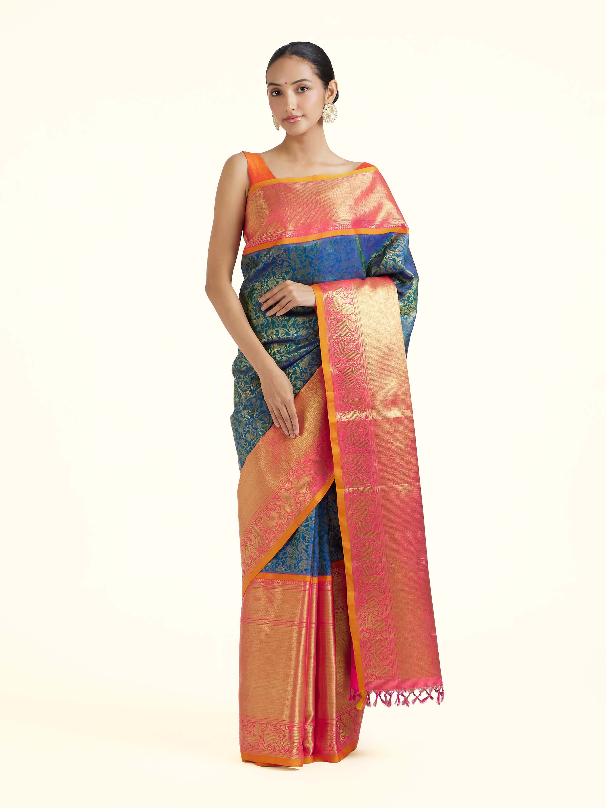 Front view of blue silk Kancheepuram saree with rich zari woven motifs