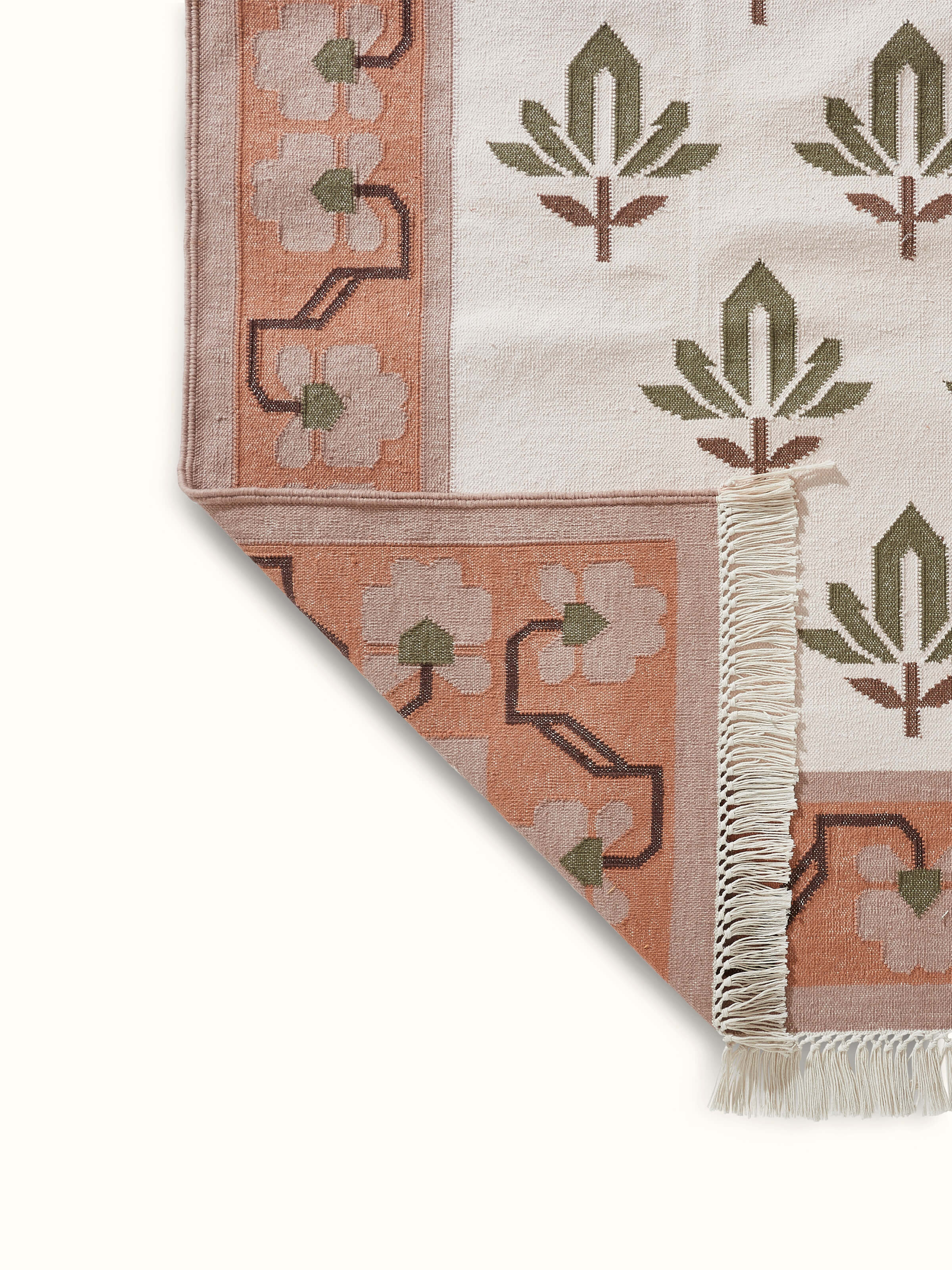 Front view of Contemporary lotus blush lawan cotton panja dhurrie, illustrating its blush color and panja weave texture.