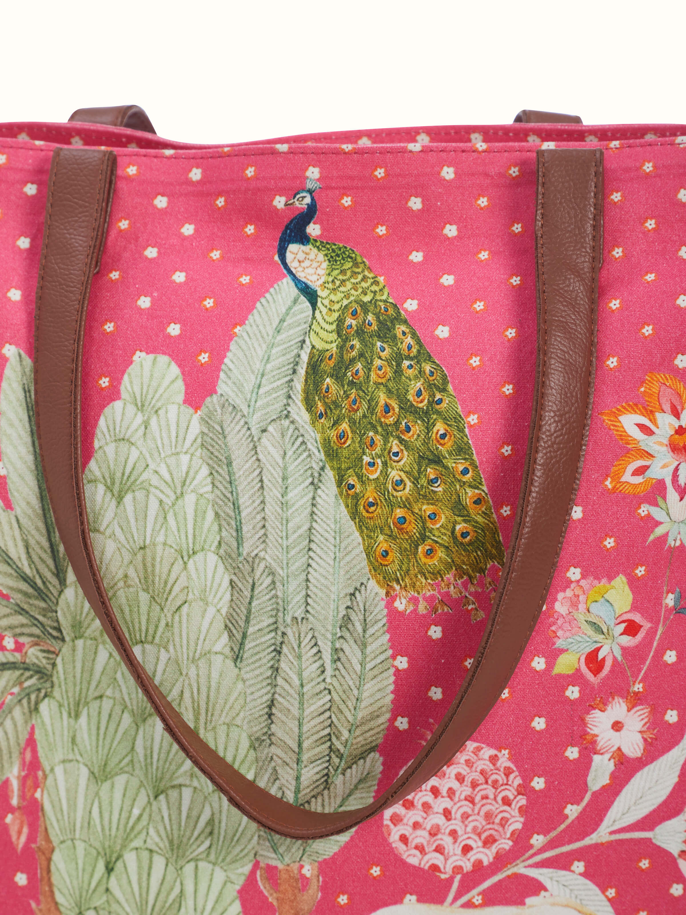 Detail view of tote bag printed with design inspired by miniature artwork showing fabric texture