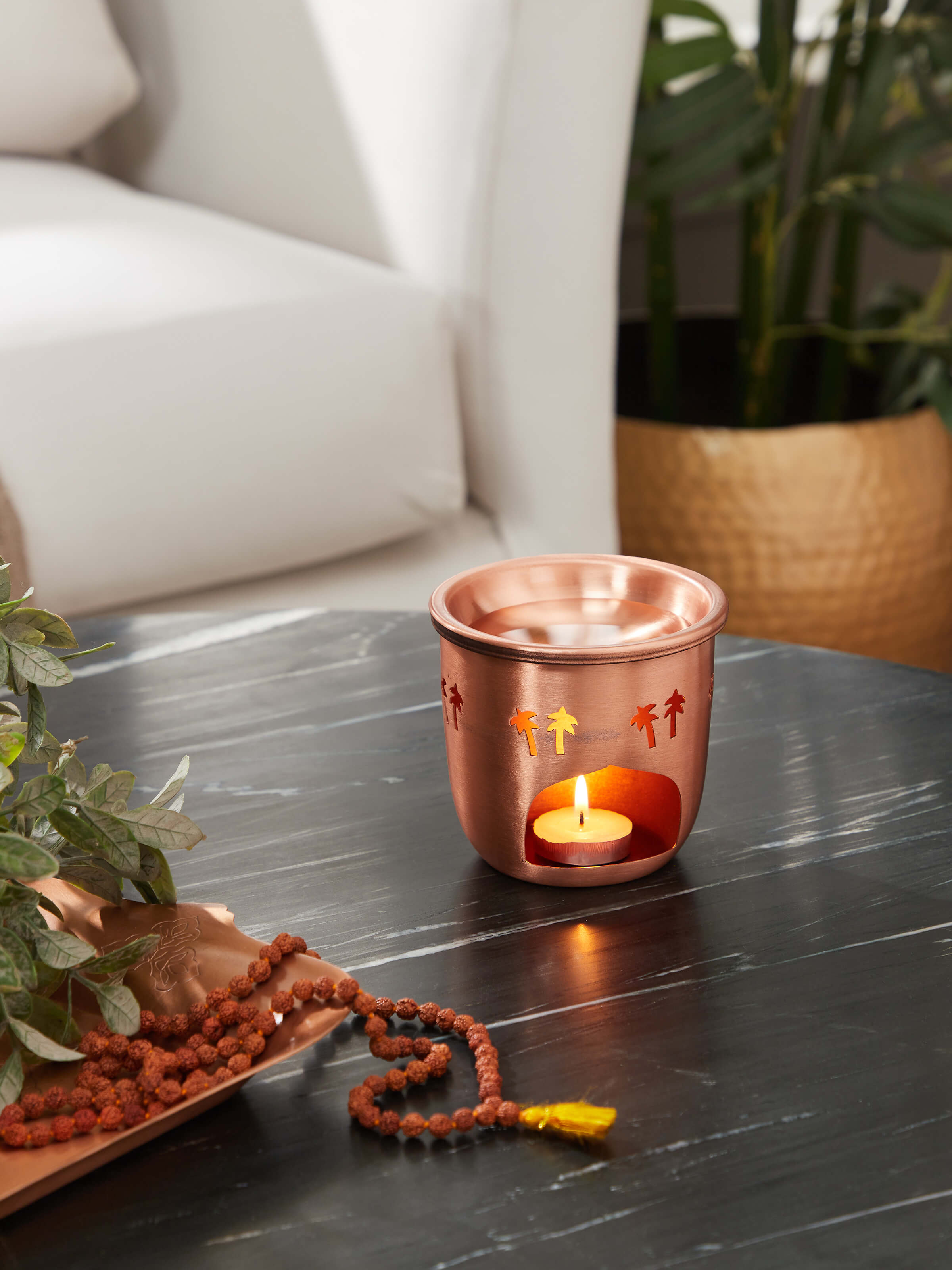 Side view of Copper Aroma Diffuser highlighting its sleek design and fine copper detailing.