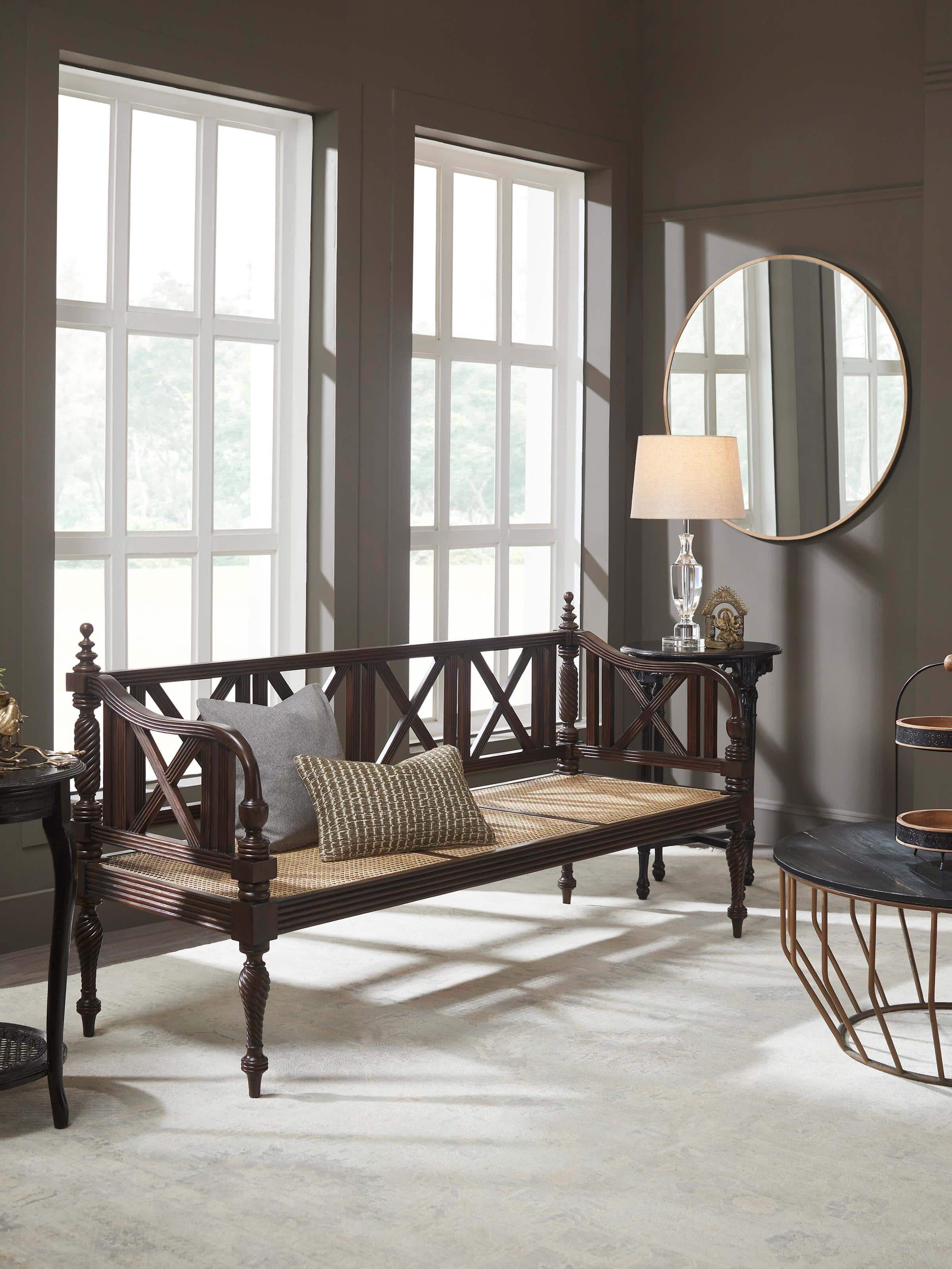 Side view of Walnut finish Mahogany wood and cane sofa showcasing premium finish and sturdy armrests