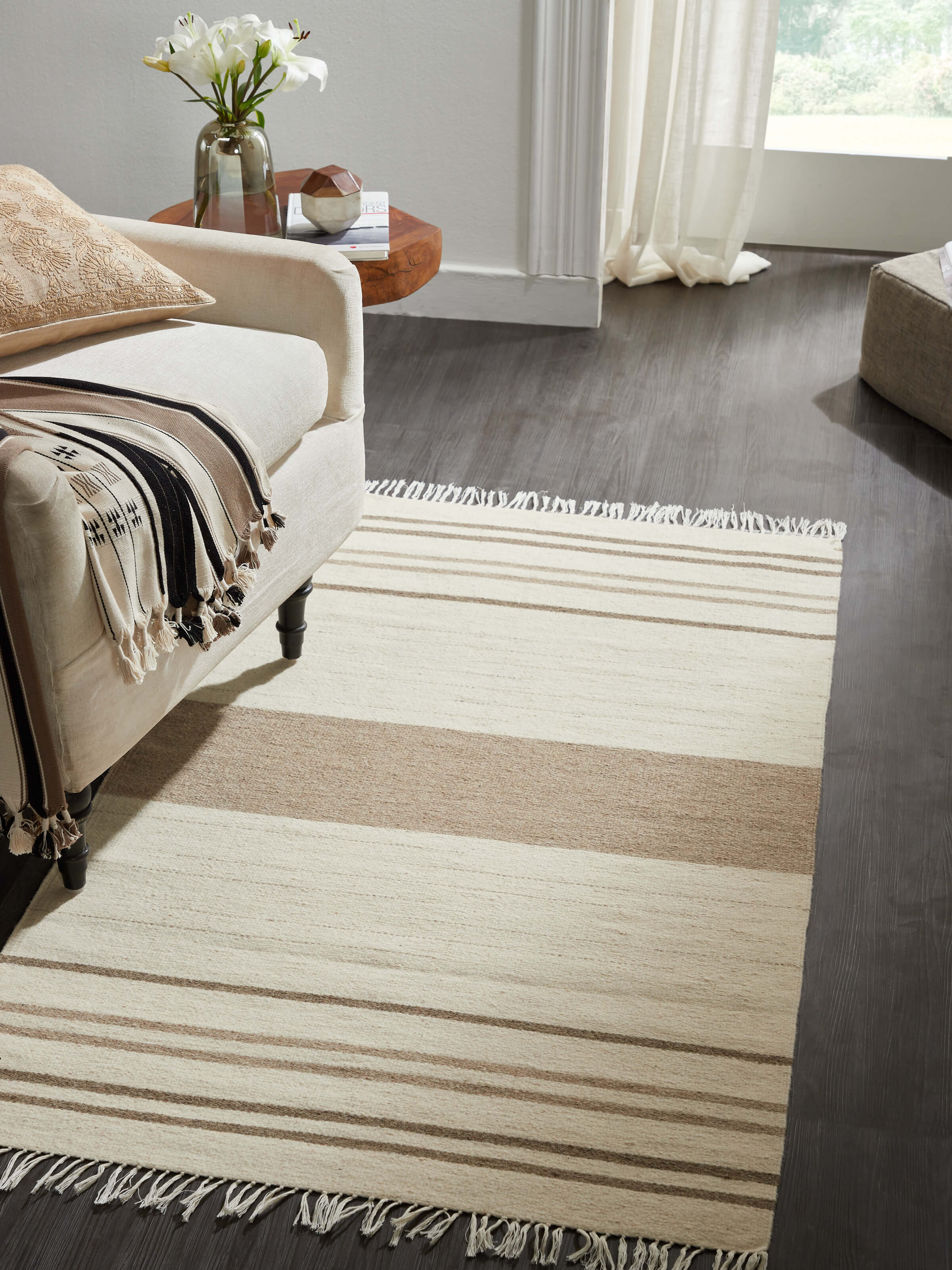 Close-up of Nomad Stripes Ivory Beige Jawaja wool & cotton handloom dhurrie showing the texture and stripe details.