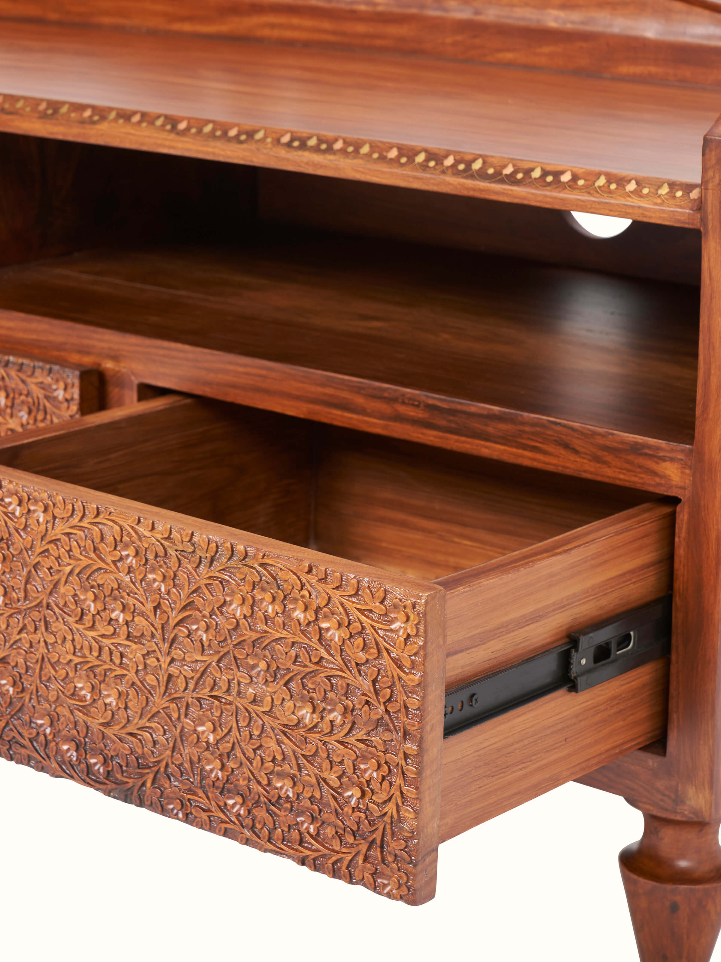 Detailed view of Carved Sheesham Wood Entertainment Unit, emphasizing the intricate carvings and rich wood texture.