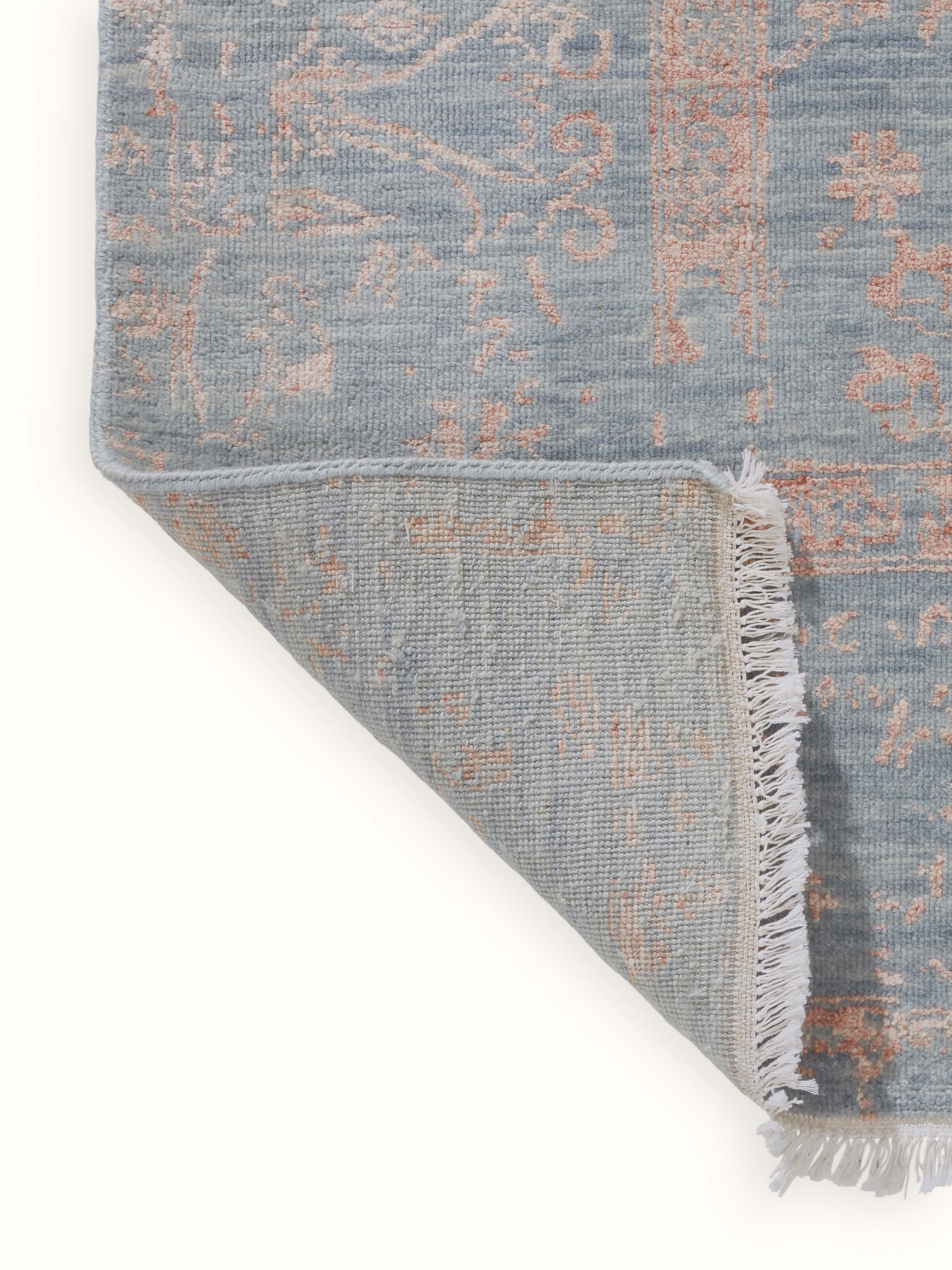 Back view of the carpet highlighting weaving technique and finishing