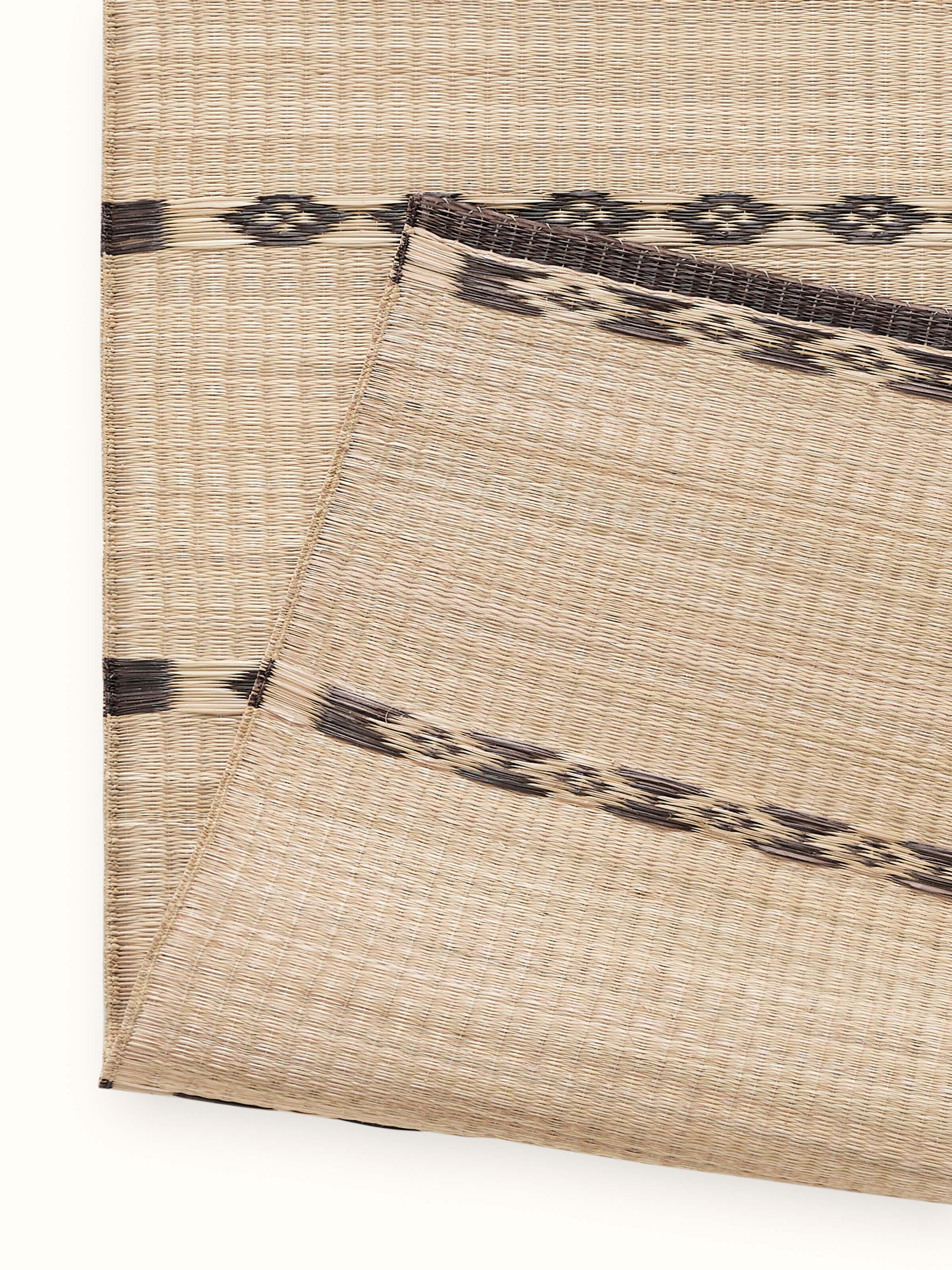 Back view of Prakriti black stripe Madurkathi table runner, revealing fine handwoven texture and finish in natural fibre.
