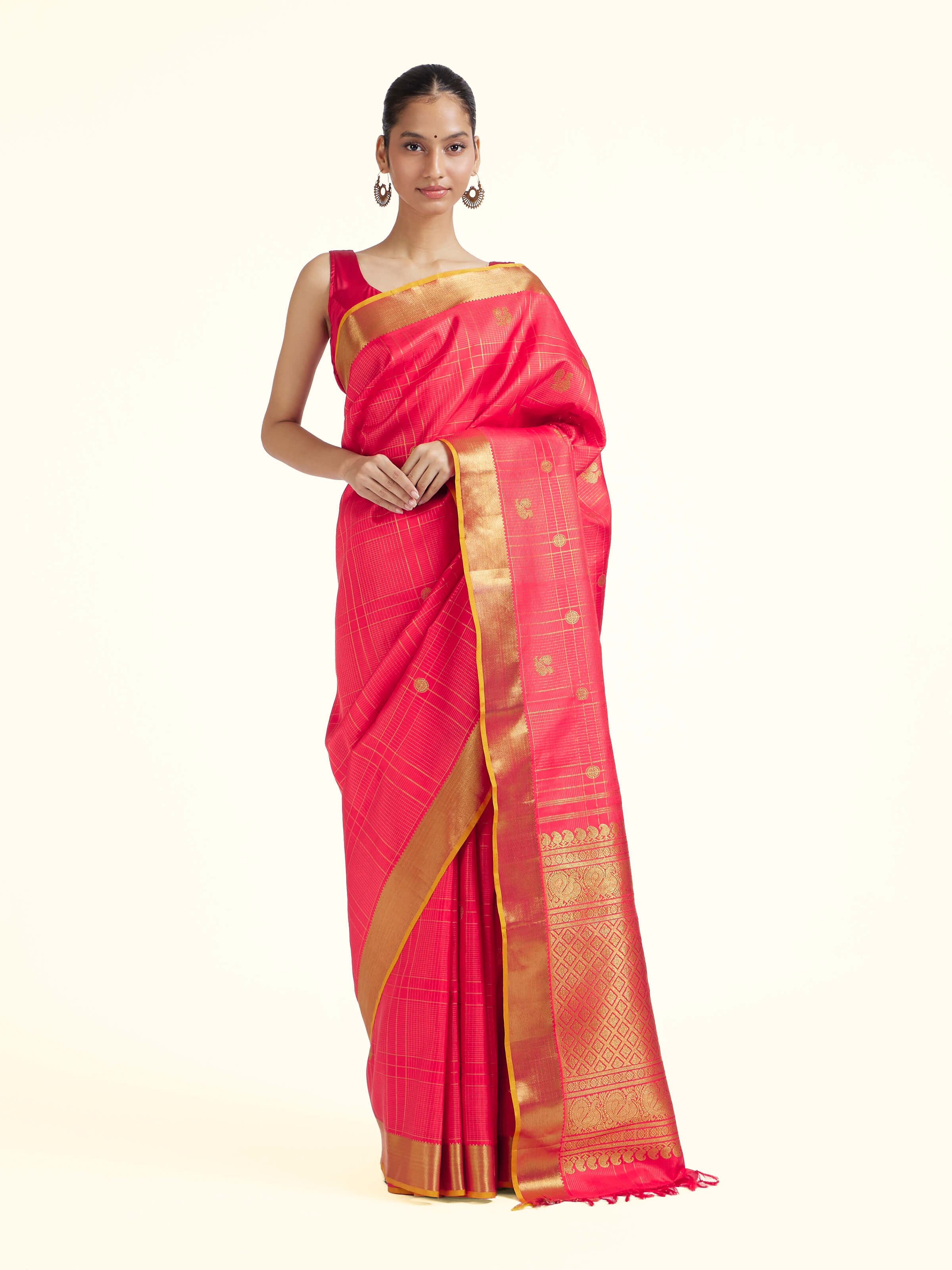 Front view of red silk Kancheepuram saree with rich zari woven motifs