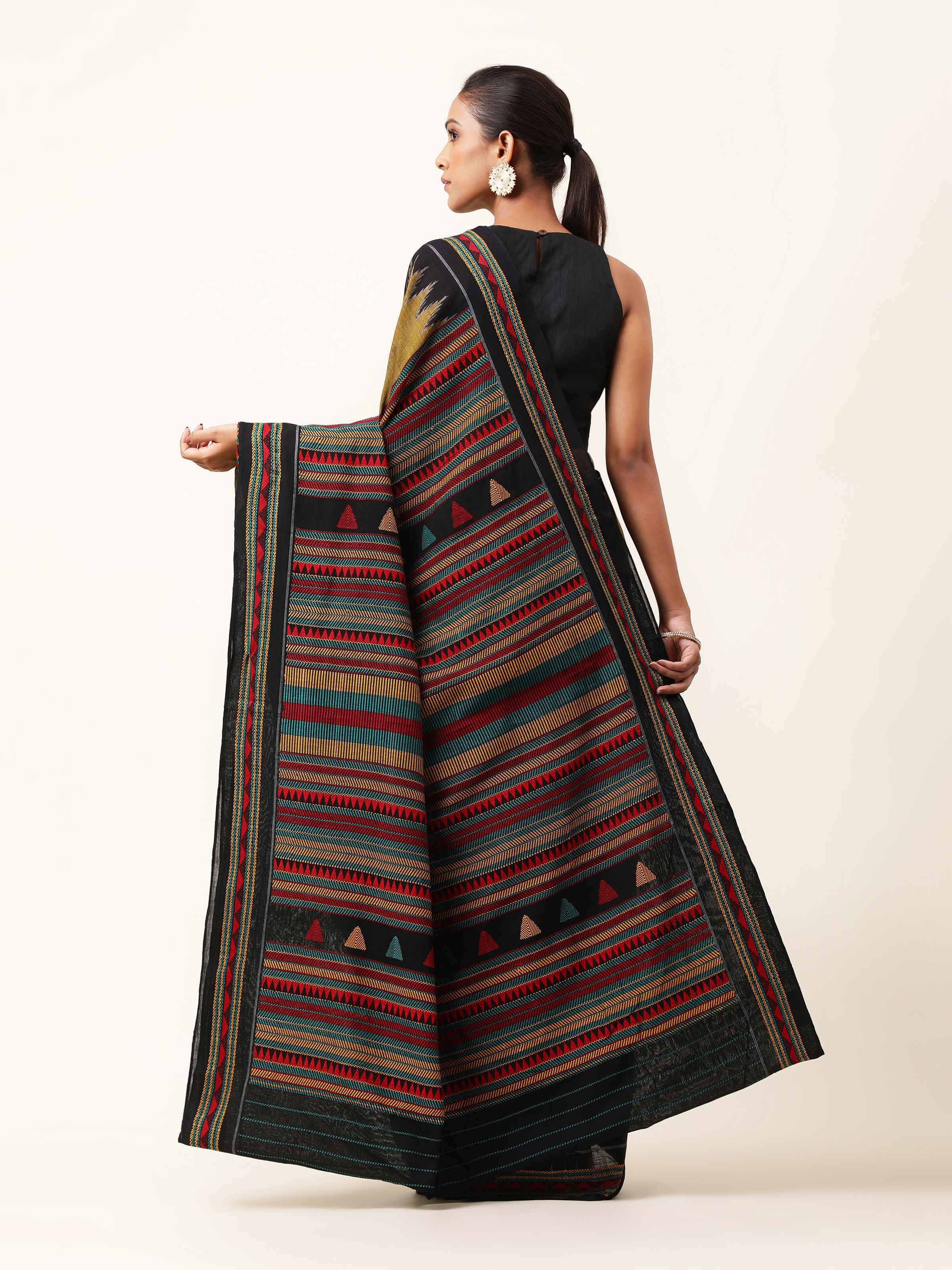 Back view of yellow Dongaria saree with neatly draped pallu and bold color palette