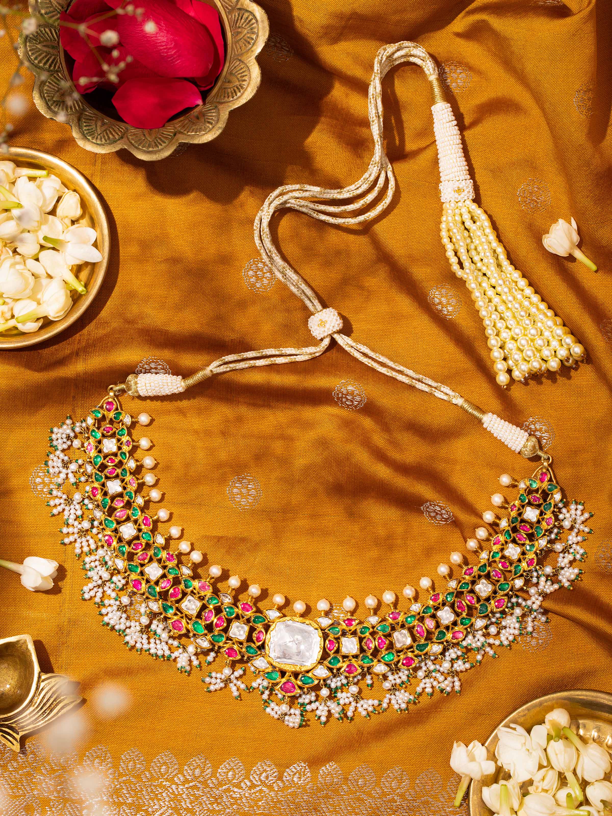Jadau 18 karat gold collar necklace worn on neck
