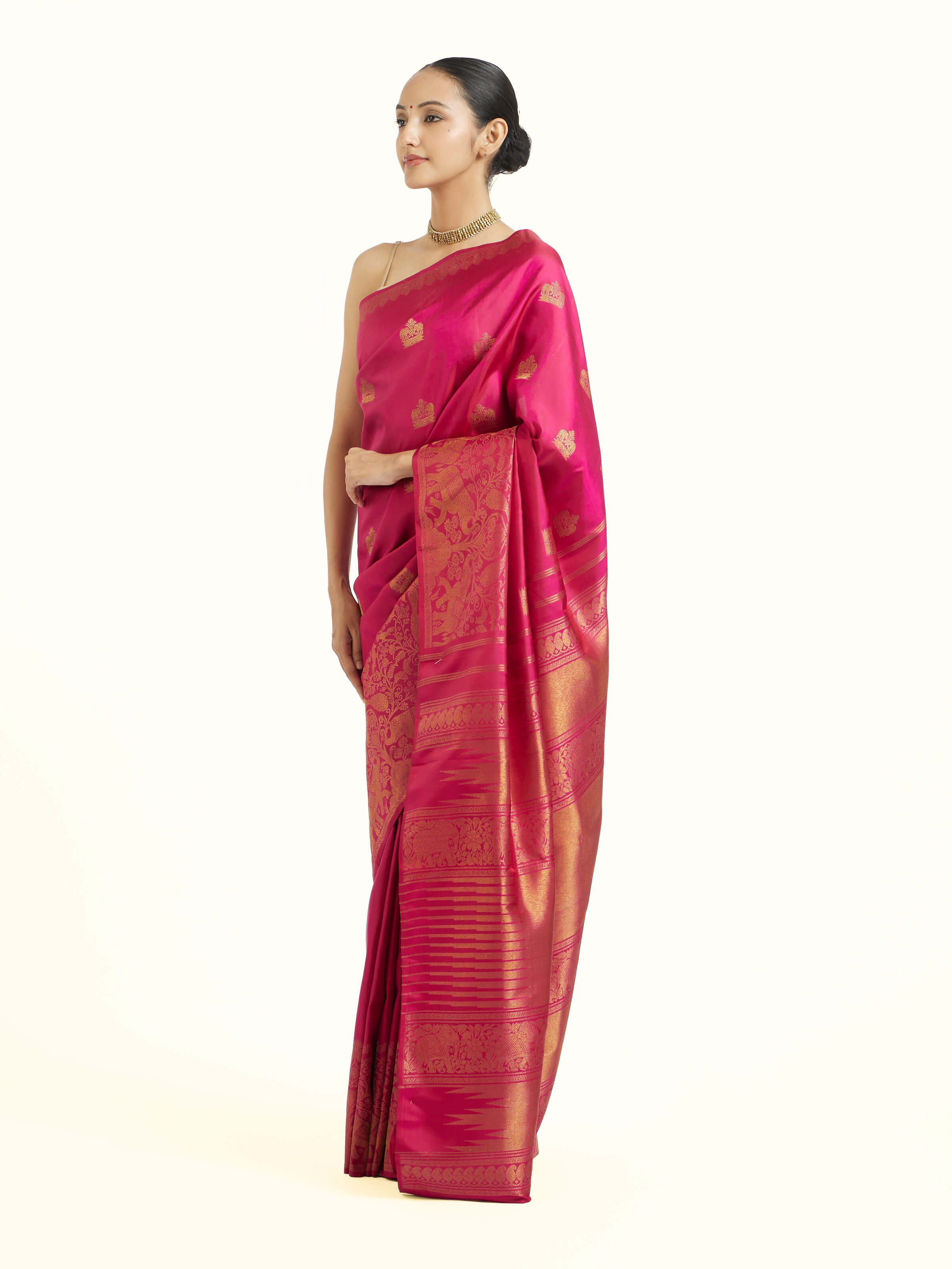 Side view of red silk Kancheepuram saree highlighting elegant drape and rich border